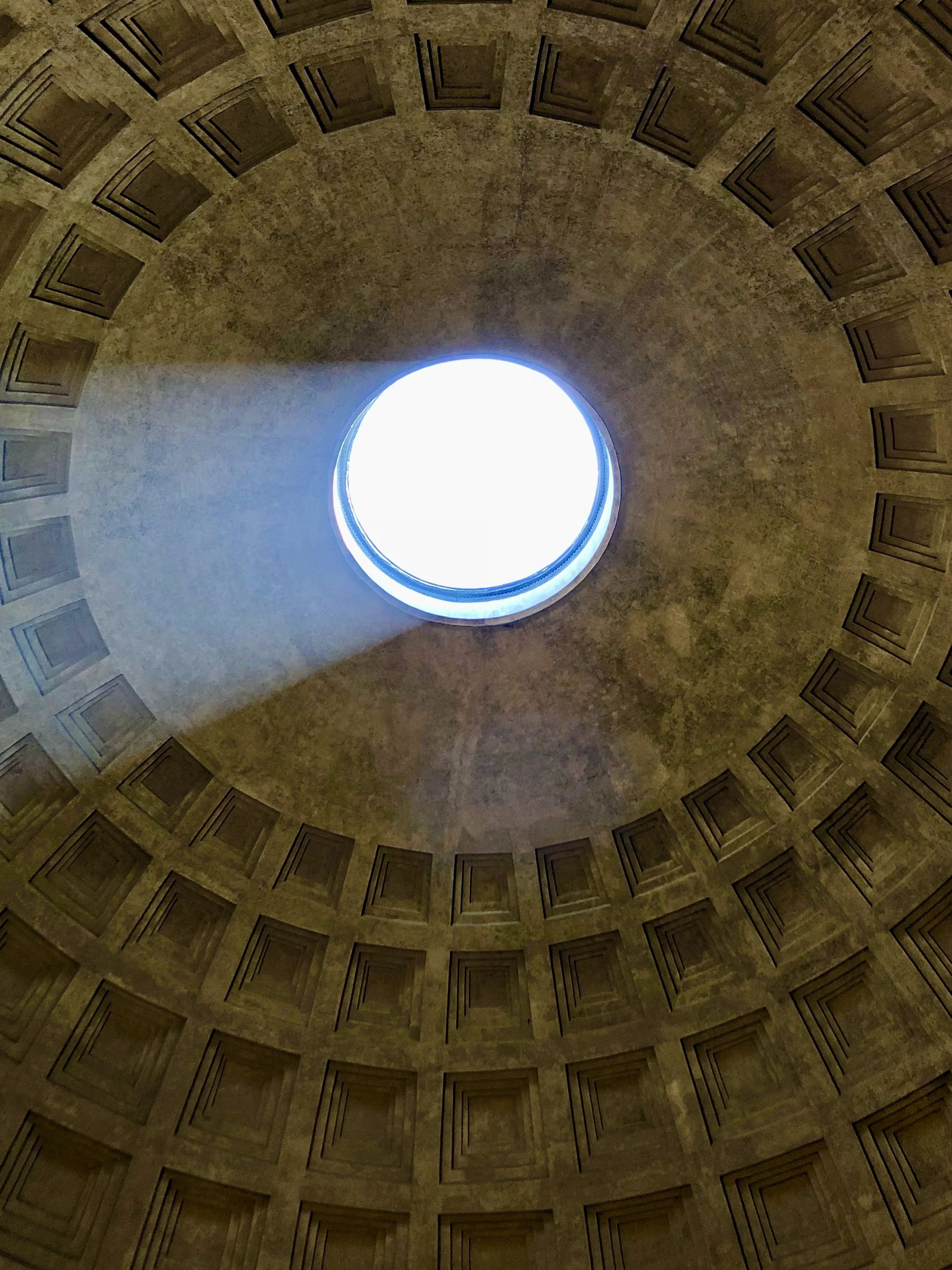 Interior view of the Pantheon dome showing the oculus and coffered ceiling design.