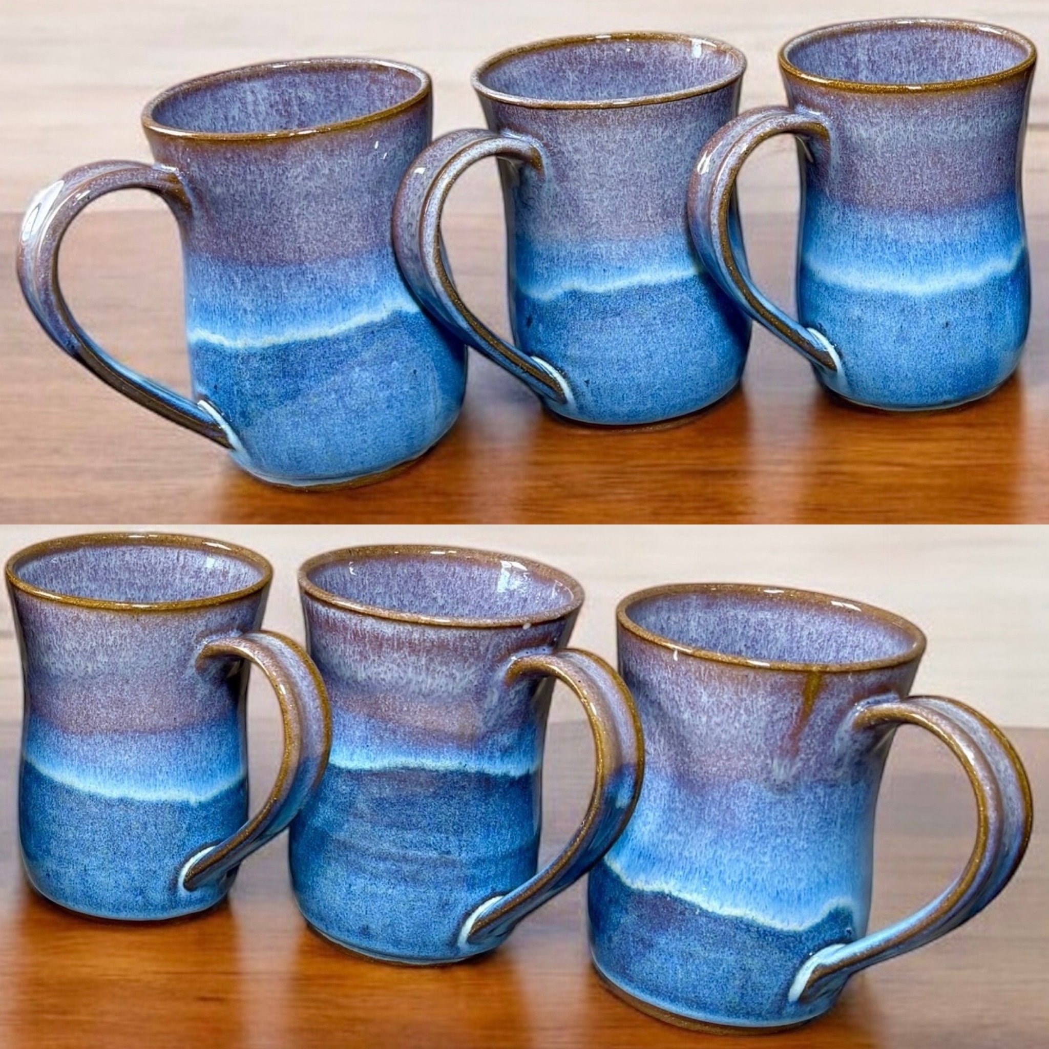 Three ceramic mugs with blue and purple gradient glaze on a wooden surface, viewed from different angles.