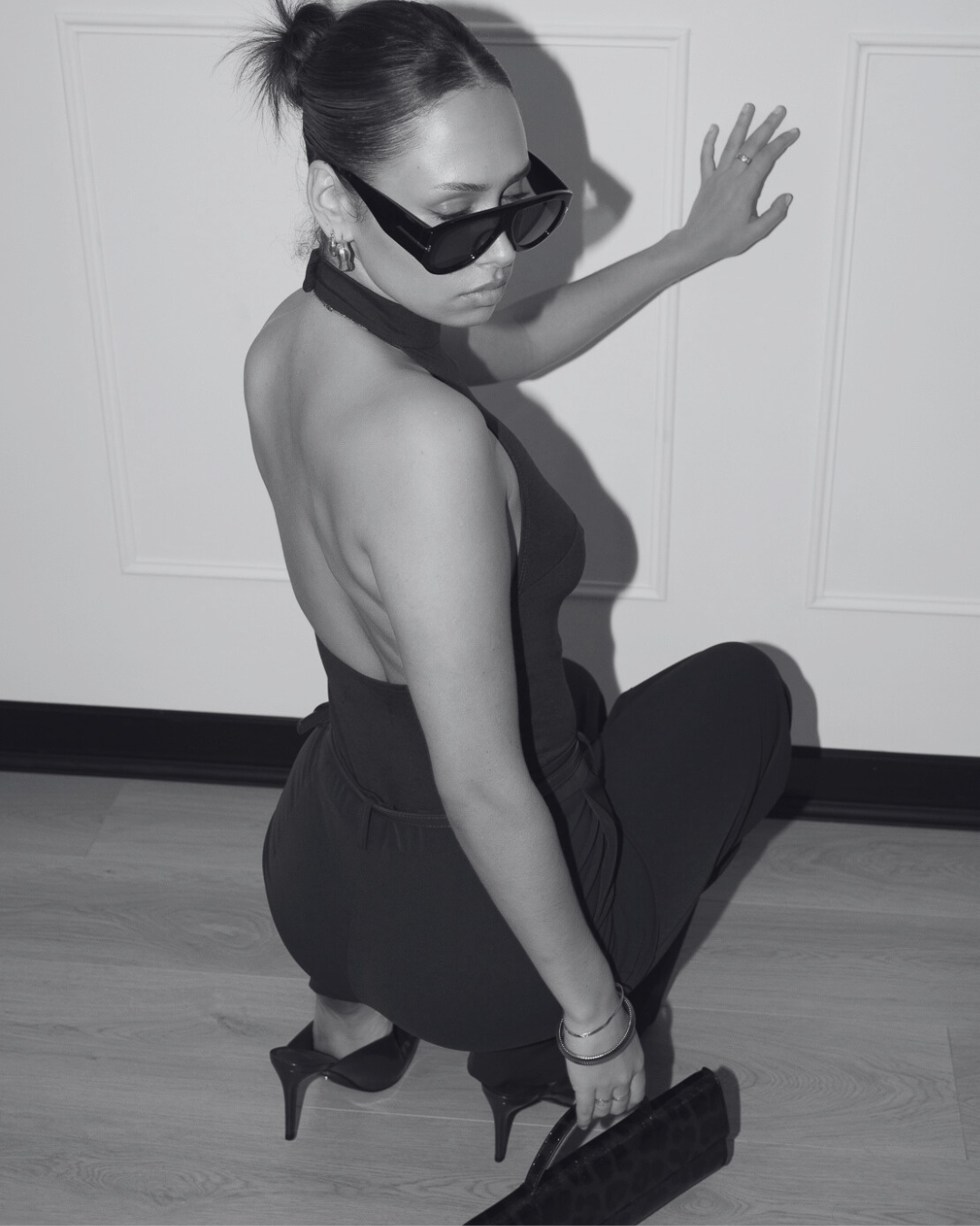 Model seated on the studio floor