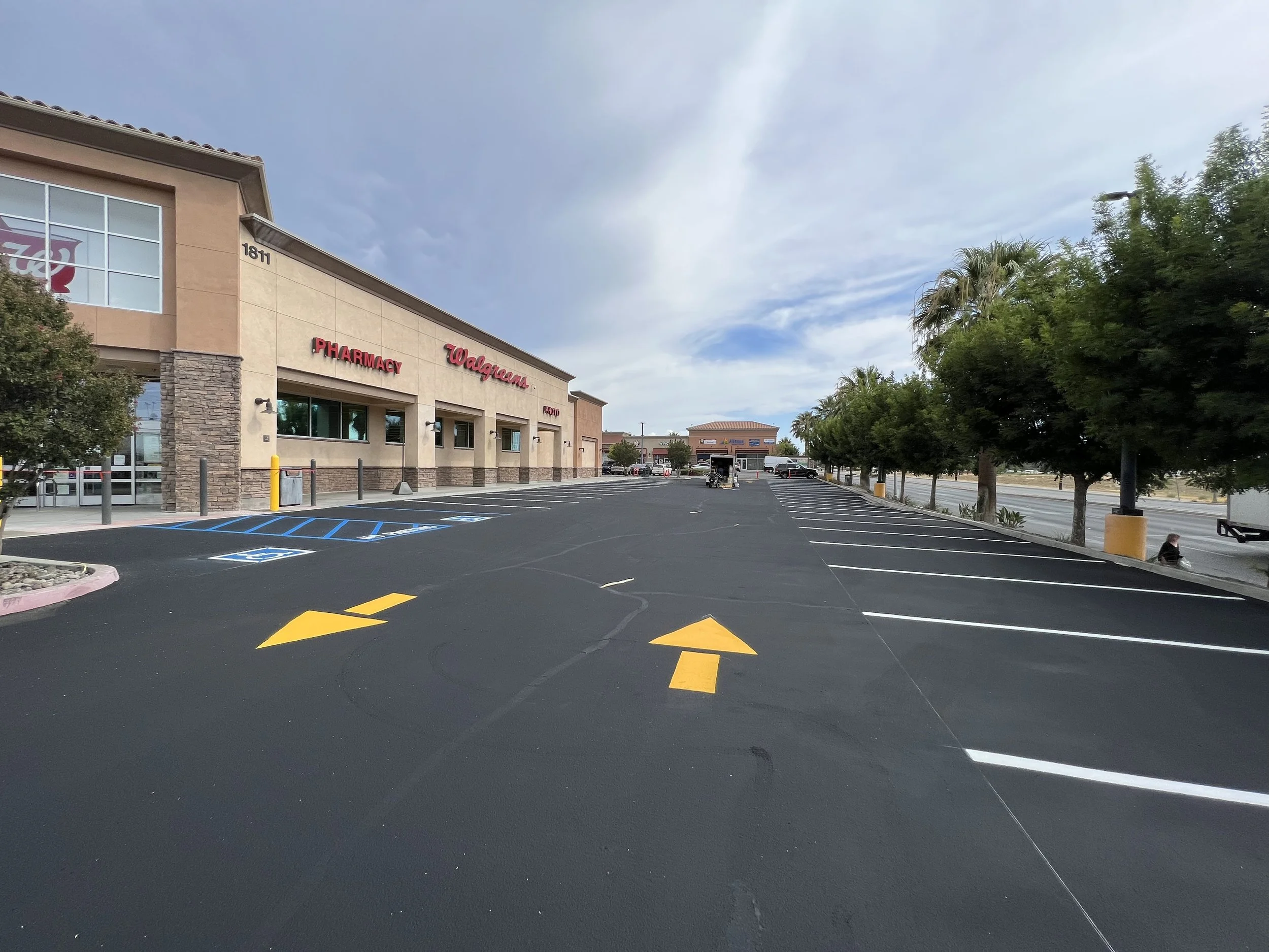 Asphalt parking lot and parking lot stripping i