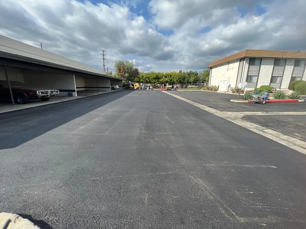 Smooth asphalt paving completed for a large commercial parking lot