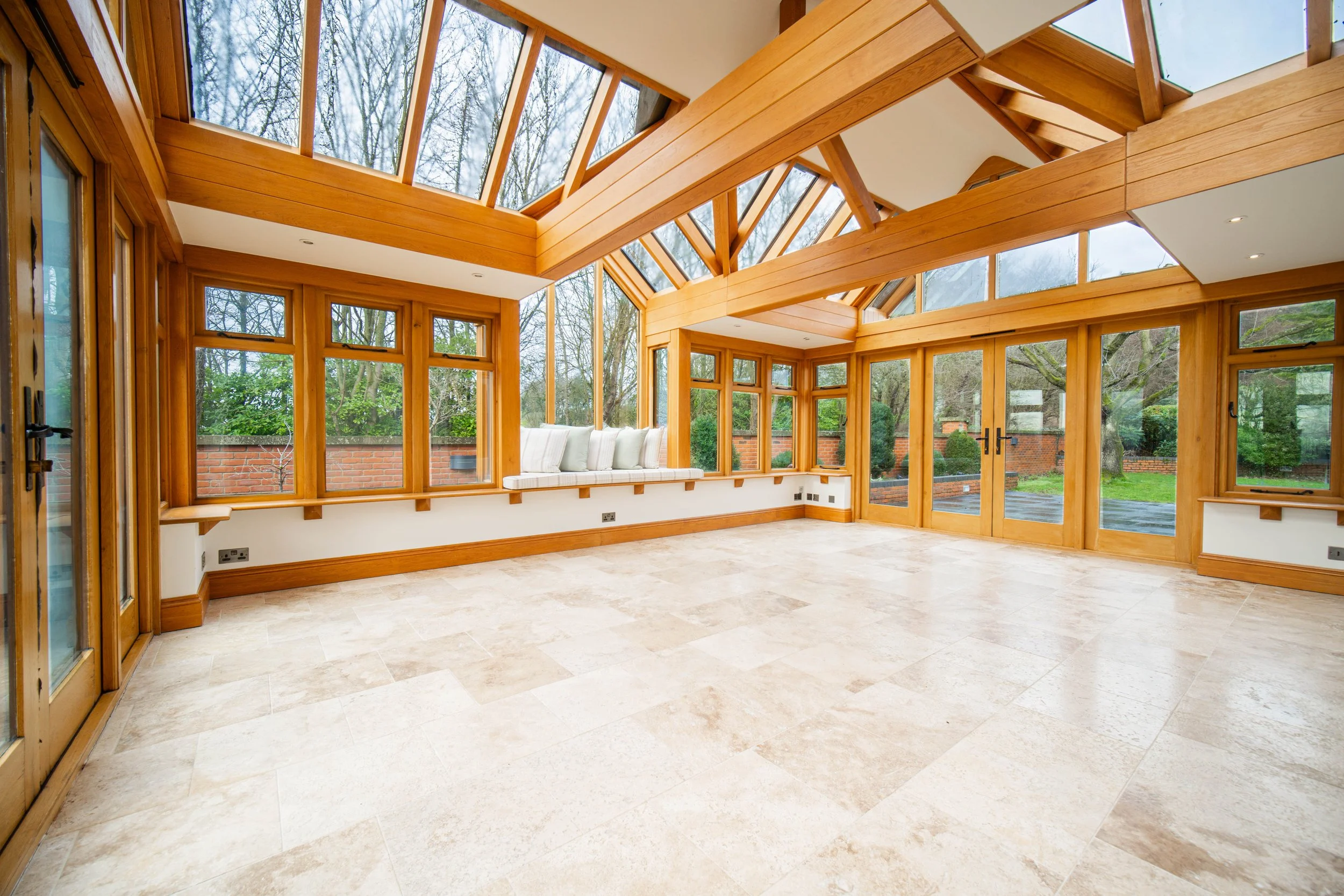 a large multi million pound listing shot by O Johnston & Co featuring a luxury orangery.