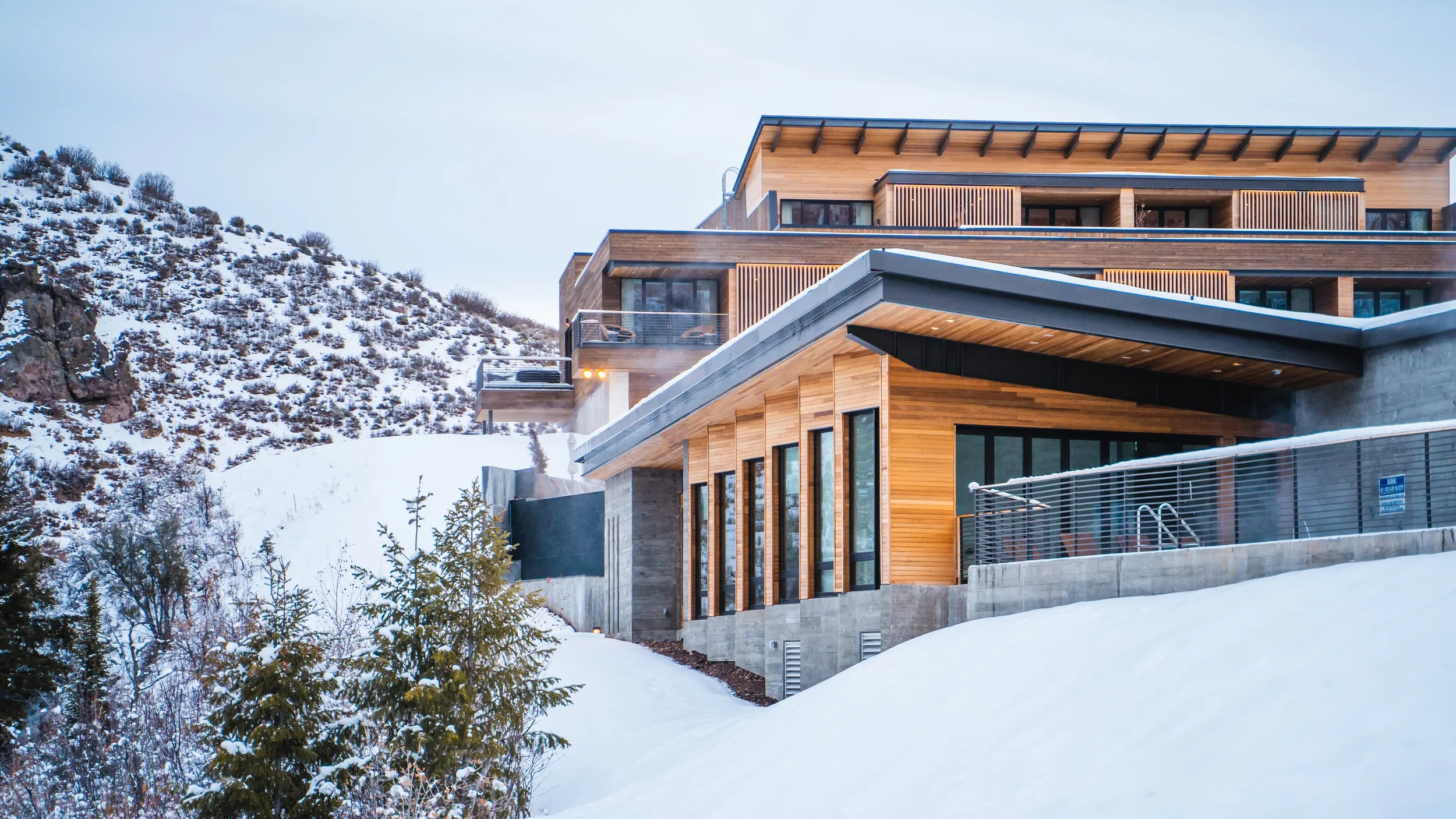 lodge-at-blue-sky-exteriors_resort_lodge-exterior-with-steam-from-pool.webp