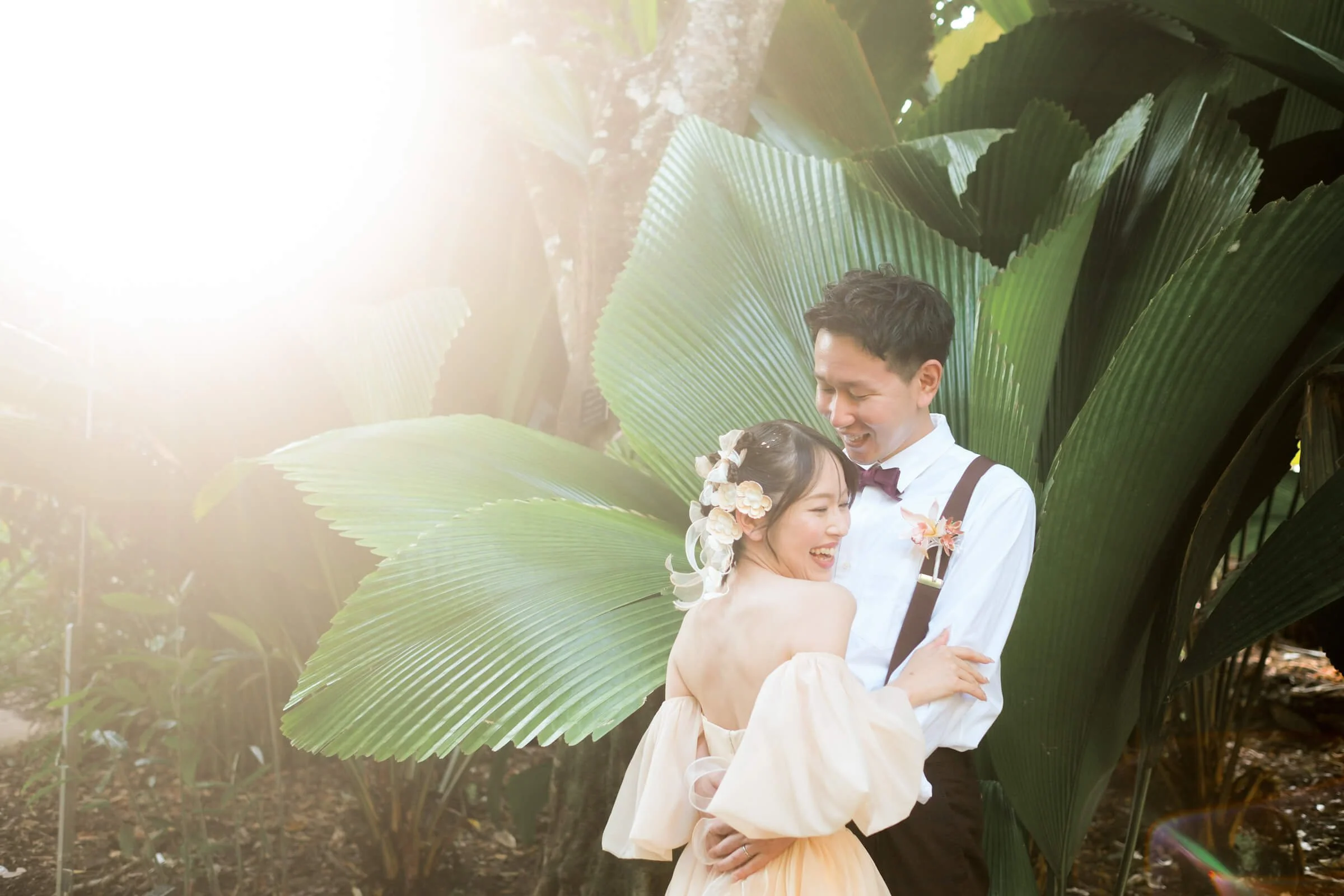 cairns-garden-wedding-photo-sunlit-tropical-leaves-dreamy-light-bridal-portrait.jpg