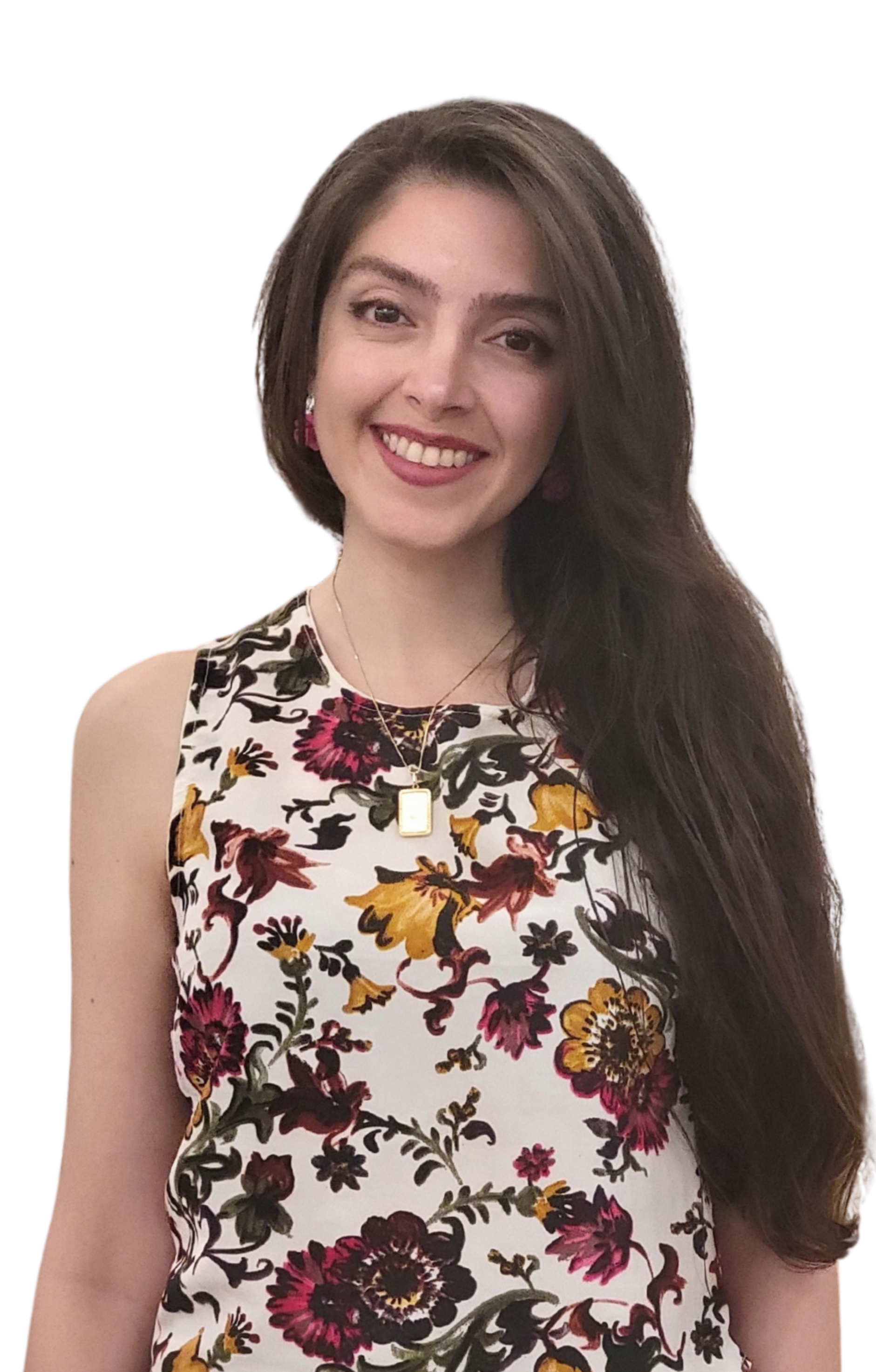 A woman with long brown hair wearing a sleeveless floral dress and jewelry, smiling against a black background.