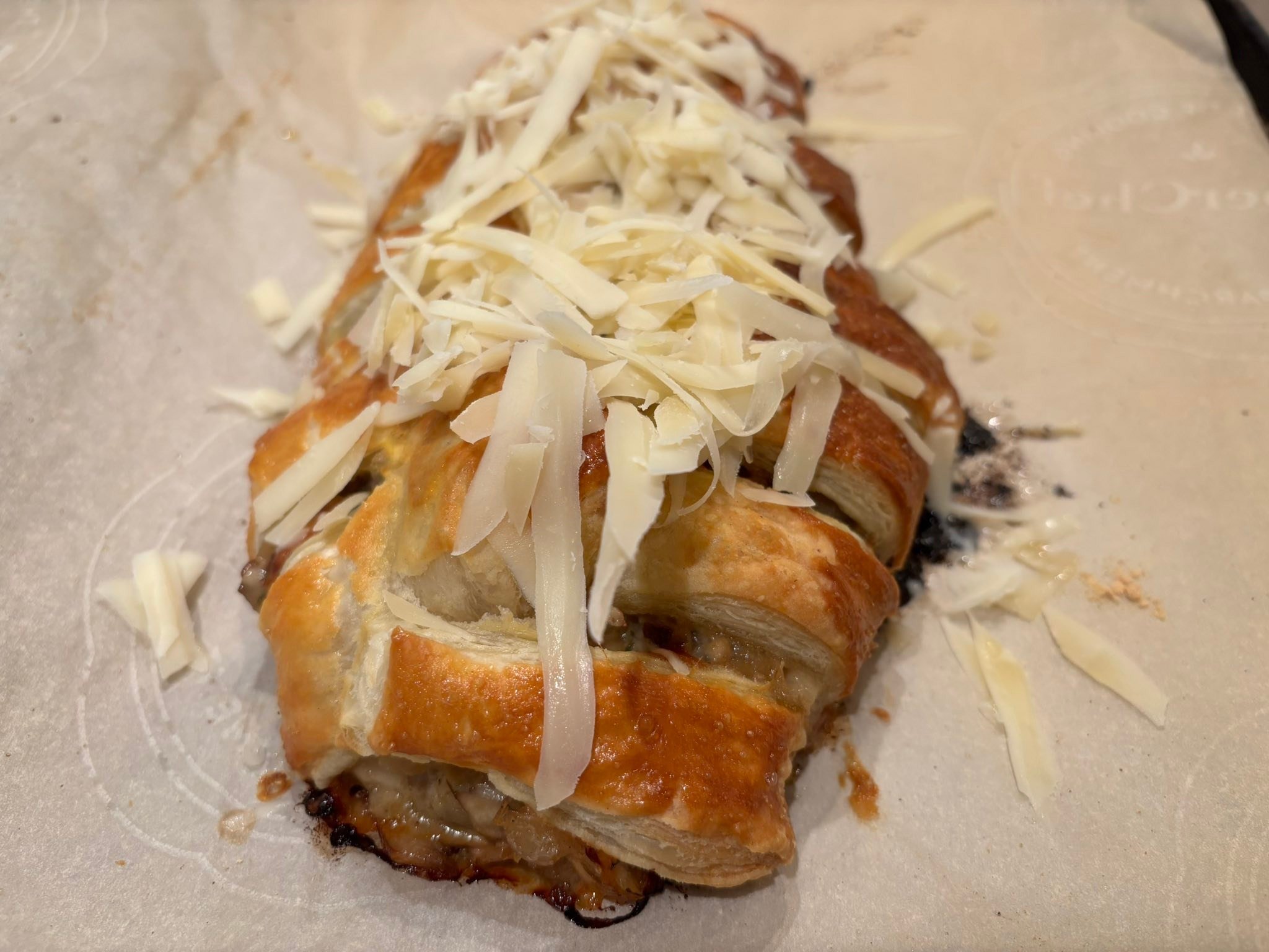 Now that 98% of the orders are done, time to take a break and try out some new Christmas Day appetizers. This is mushrooms, onions, garlic, herbs and Gruy&egrave;re cheese baked in a puff pastry and then topped with more grated cheese. Yum!