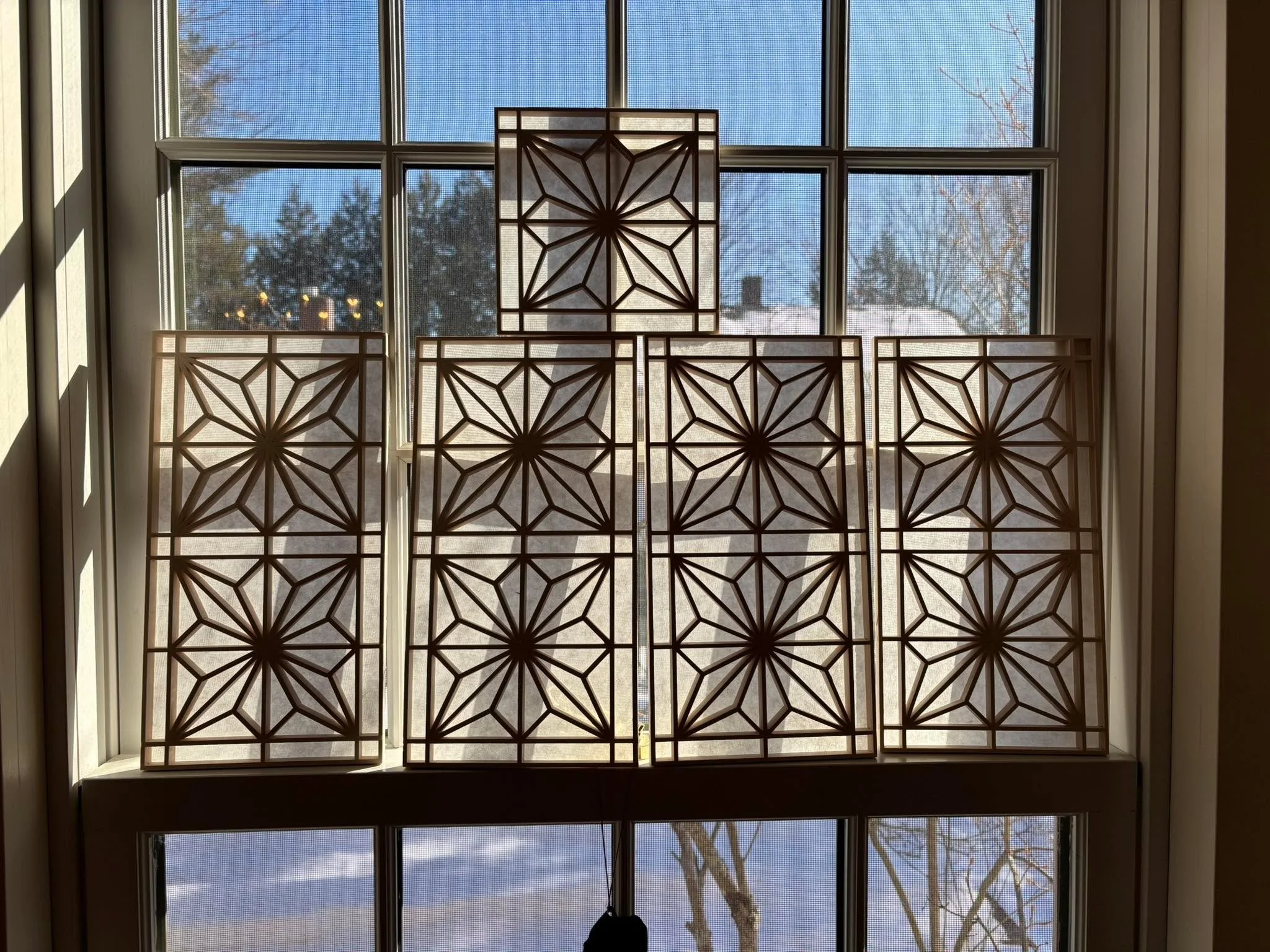 Traditional rice paper has been applied and trimmed to the Kumiko lamp panels. If necessary, paper can be spritzed with water and allowed to dry. This will further tighten the paper. So far I have not needed to do that procedure.

I can see why the J