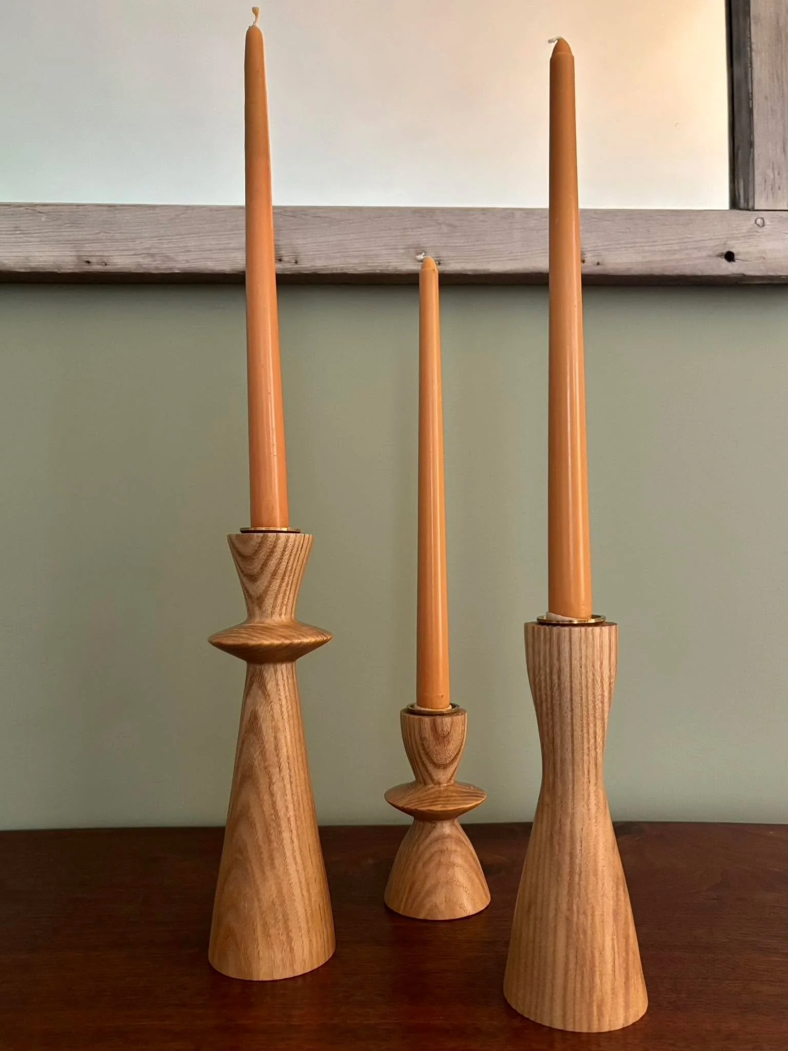 This is what happens when your daughters are visiting from far away and your wife finds some candlestick designs she likes. 

Back in late February, I turned up two sets of these candlesticks. Ash wood with brass inserts. My wife also purchased two d