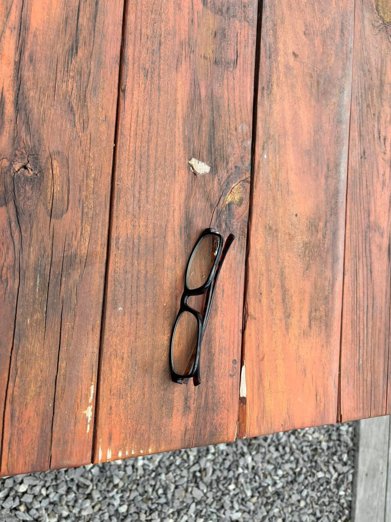 Left by the chairs.