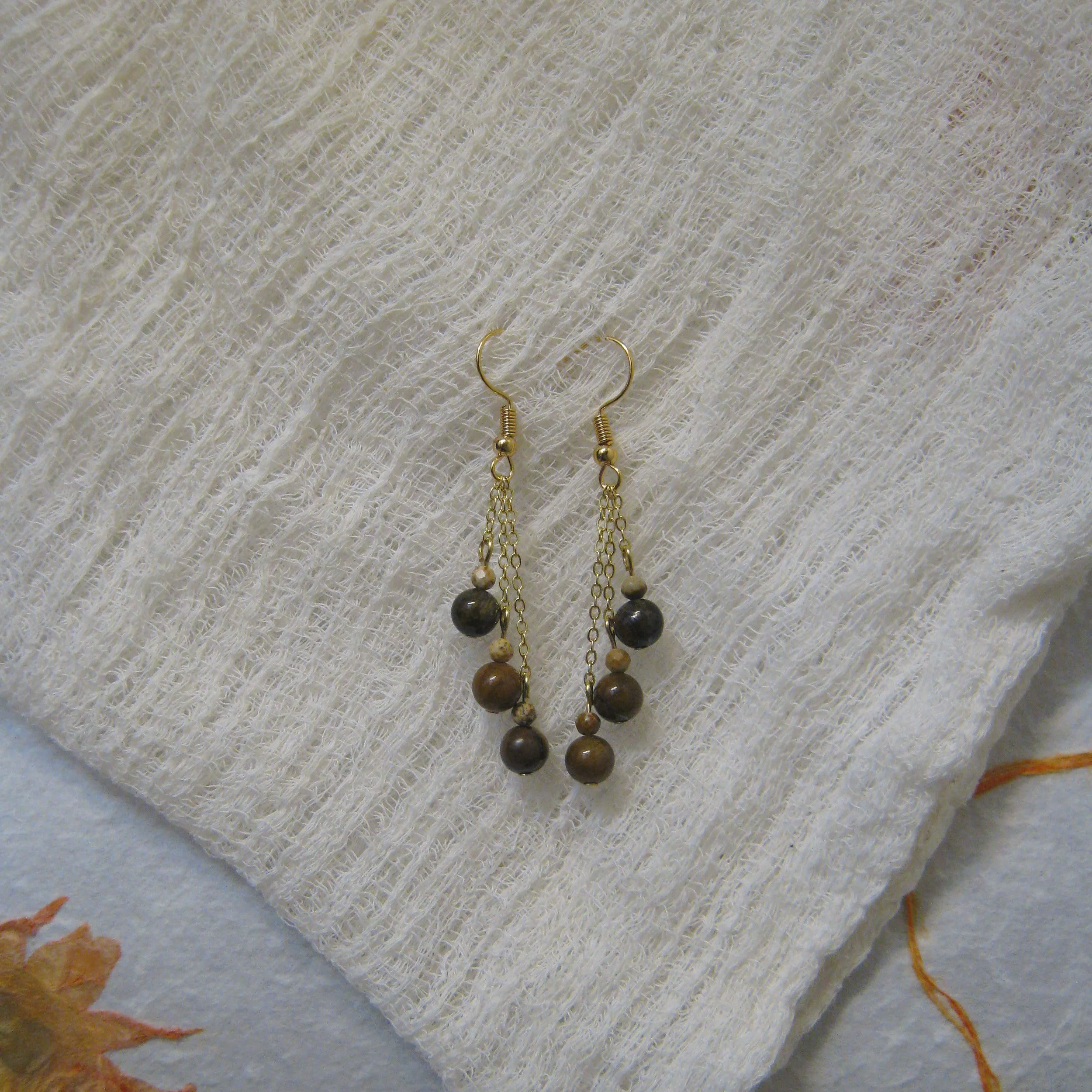 Tigers Eye & Brown Jasper Dangle Trio Earrings - $12 | Tigers Eye is associated with courage, strength, and protection. It provides clarity and vision and is known for having grounding energy and vitality. Brown Jasper harnesses the power to make ind