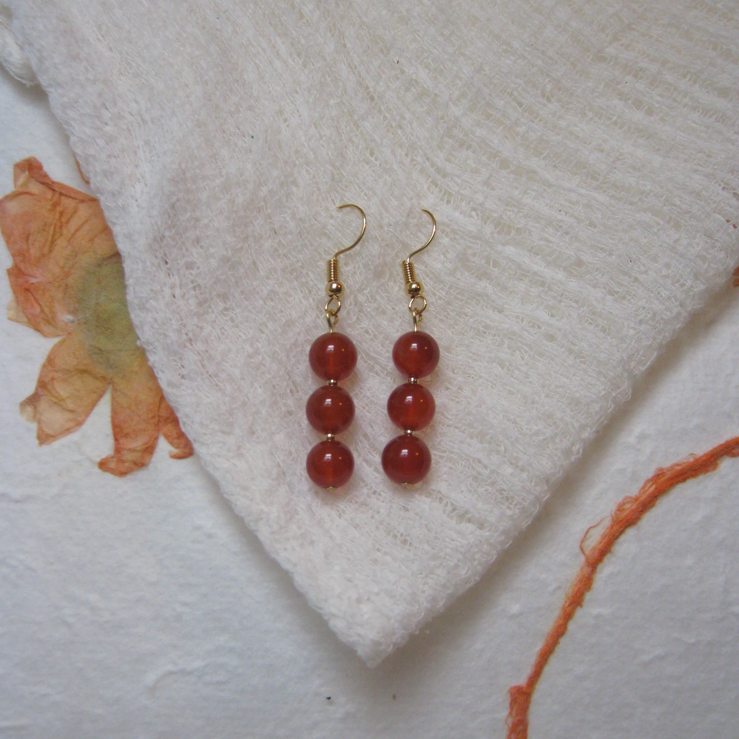 Carnelian Stack Earrings - $12 | Carnelian is known for being a stone of courage, endurance, energy, leadership, and motivation. It also helps you grow confidence and boosts your creativity. Carnelian is very grounding, helping to calm the mind and e
