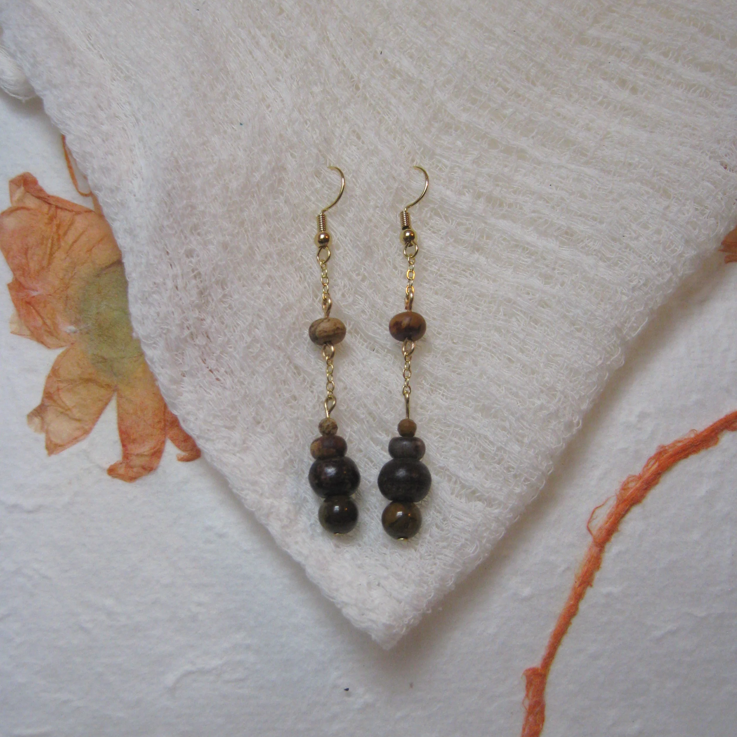 Picasso Jasper & Wooden Bead Dangle Earrings - $12 | Picasso Jasper is comprised of Red or Pink Jasper and Snow Quartz, and it resembles abstract art. It is named after the artist Pablo Picasso, and holds grounding and calming vibrations, promoting s
