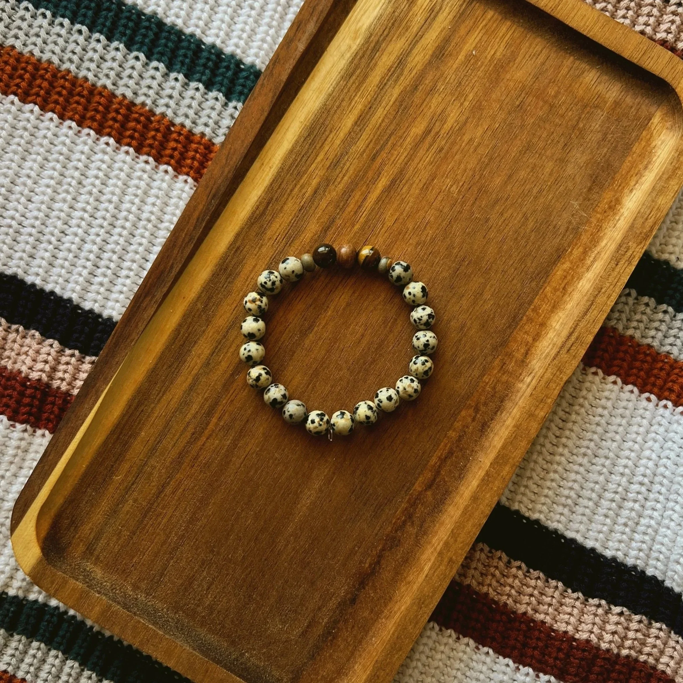 Dalmatian Jasper with Tigers Eye Seamless Bracelet - $18 | Size: M | Dalmatian Jasper is known for promoting mental sharpness and peaceful feelings of completeness, mastery, and tranquility as well as providing protection and anchoring qualities. Tig