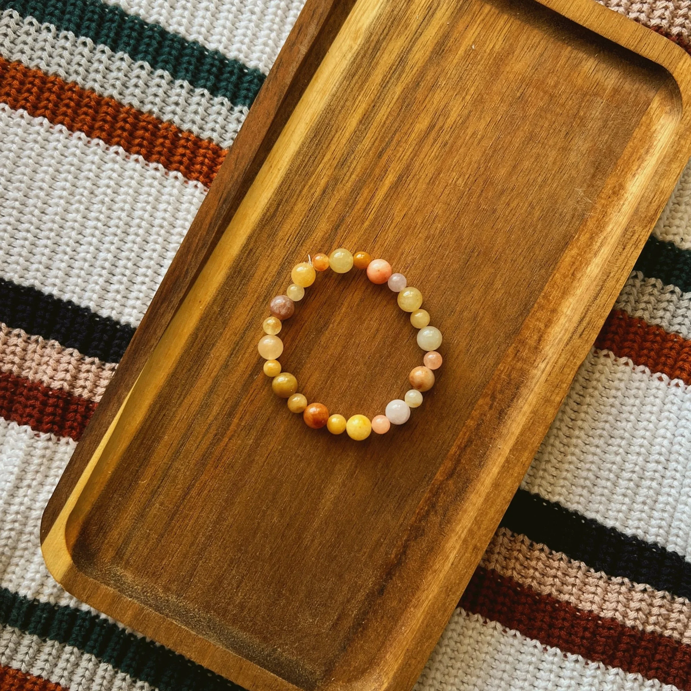 Light Yellow Imperial Jade Seamless Bracelet - $18 | Size: M | Yellow Light Imperial Jade is associated with wealth, prosperity, and joy. It is a stone of optimism and light. In certain cultures, it can represent good fortune, loyalty, and enhance co