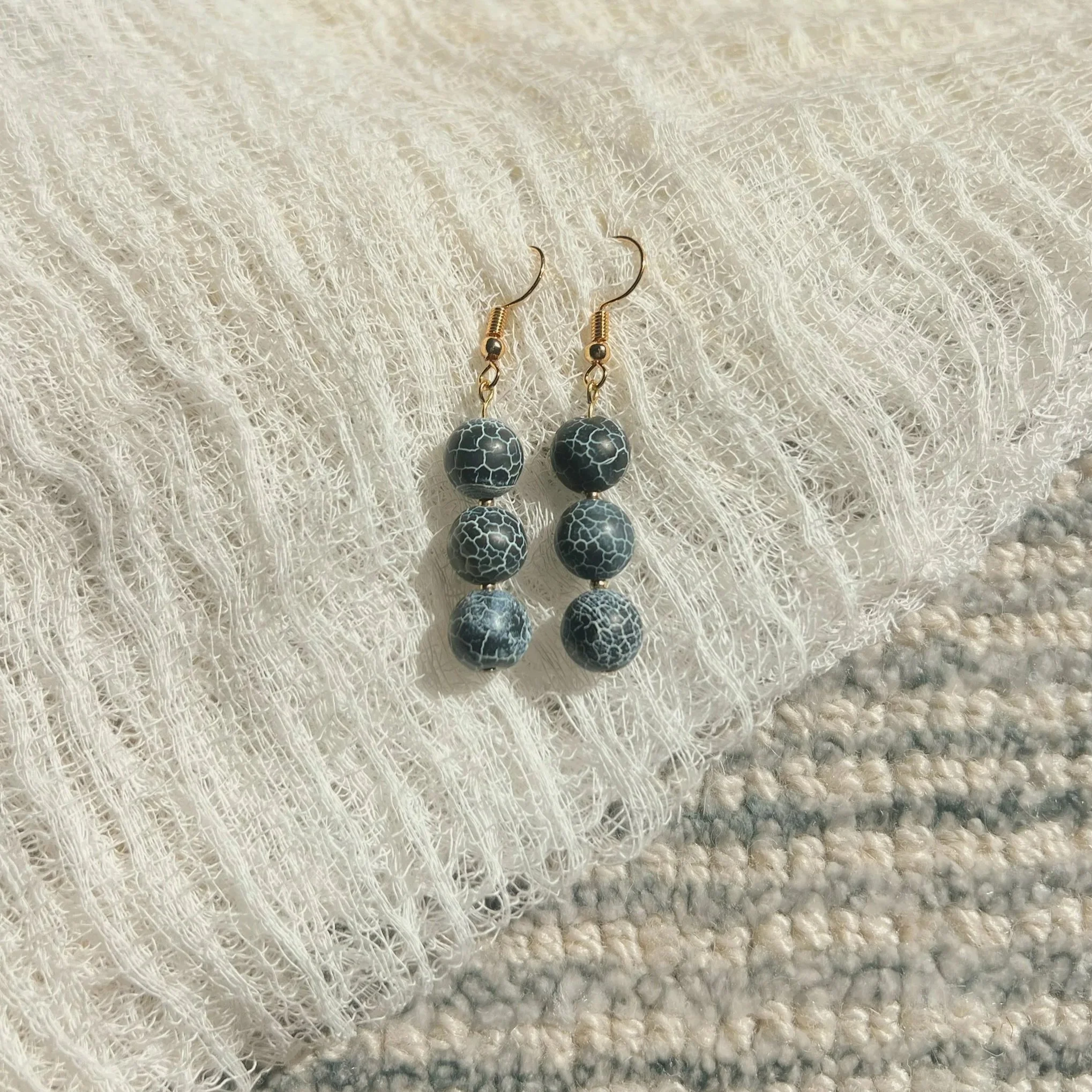 Crackled Blue Agate Stack Earrings - $12 |  Blue Agate is associated with harmony, tranquility, and emotional stability. It is believed to calm anxious thoughts, reduce stress, and promote inner peace. It resonates with the throat chakra, supporting 