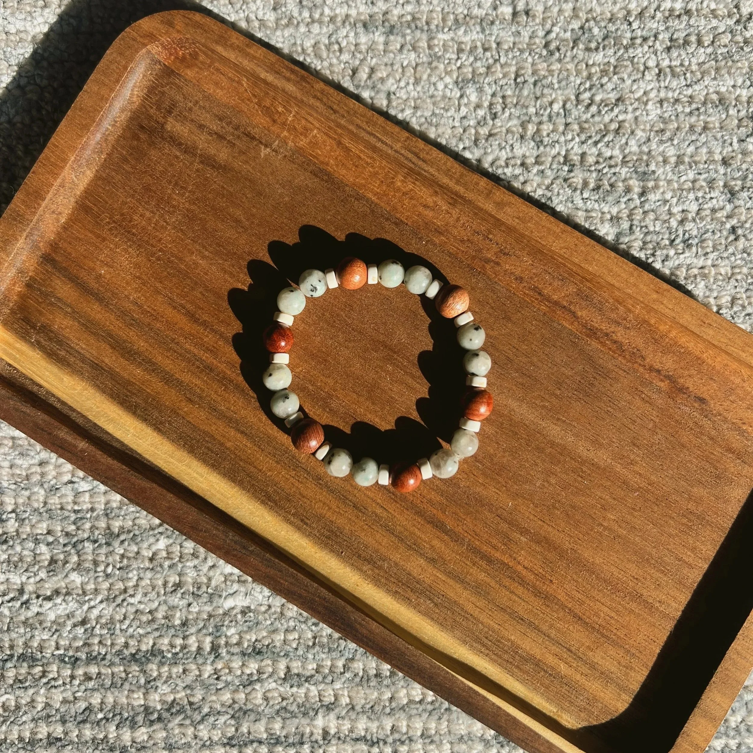 Kiwi Jasper & Wooden Bead Seamless Bracelets - $18 |  Kiwi Jasper can help enlighten your mental fortitude while enhancing the energies you produce. It aids in great communication, reinforcing self-confidence and strength. This stone connects to the 