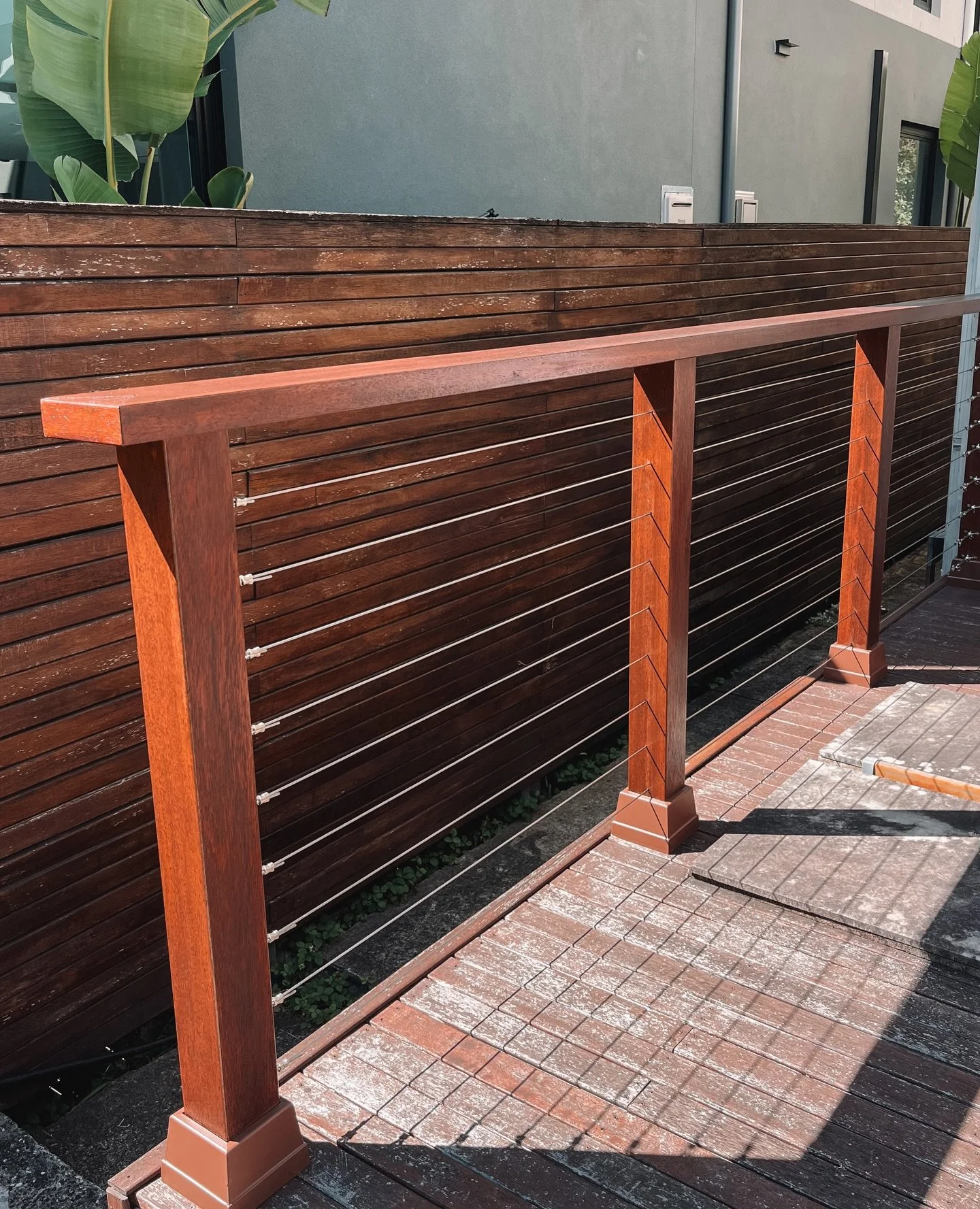 New merbau timber handrail with wire balustrade 🏡 Beautiful finish and practical for safety! 

 📞 Call Dean on 0409 245 268 to organise a free quote 📞