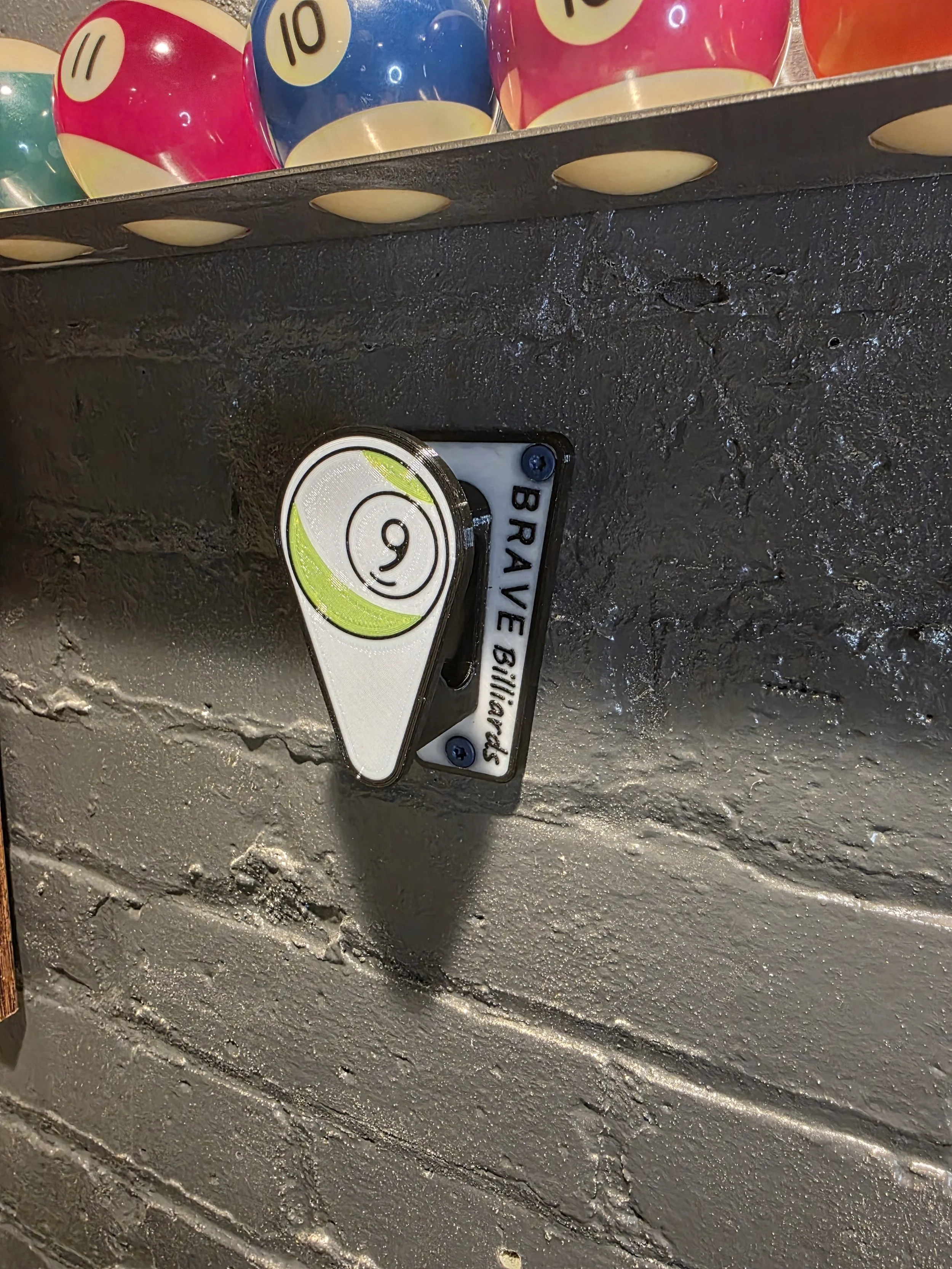 Wall mounted billiards rack holder. 8 ball and 9 ball.