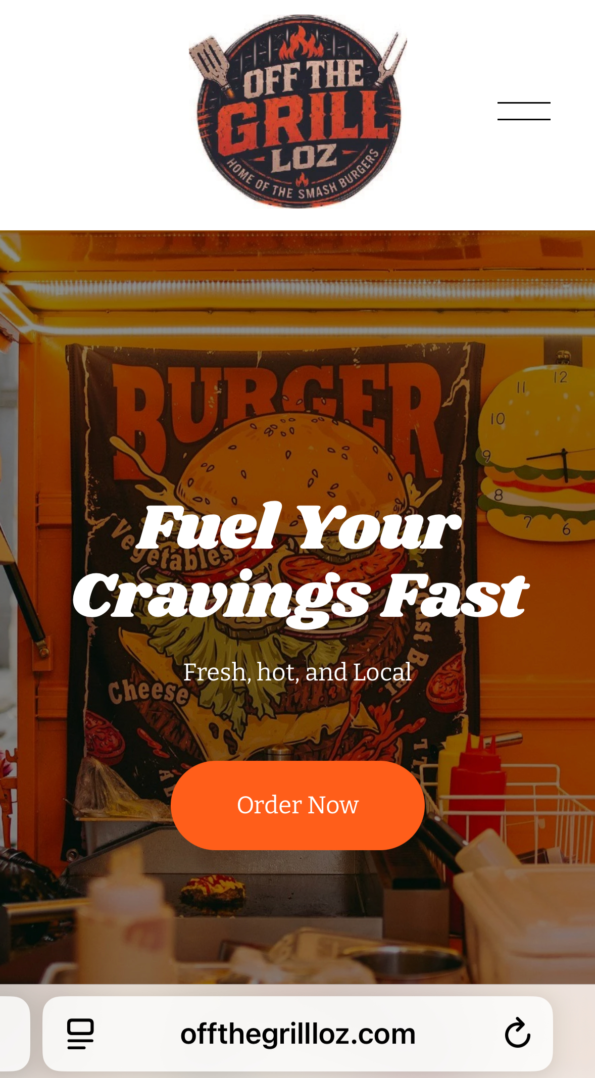 A promotional image for Off The Grill Loz featuring a food stall with a large sign showcasing a burger with cheese, lettuce, tomato, and a sesame seed bun, along with mustard and ketchup bottles. The background includes a poster with a burger illustr