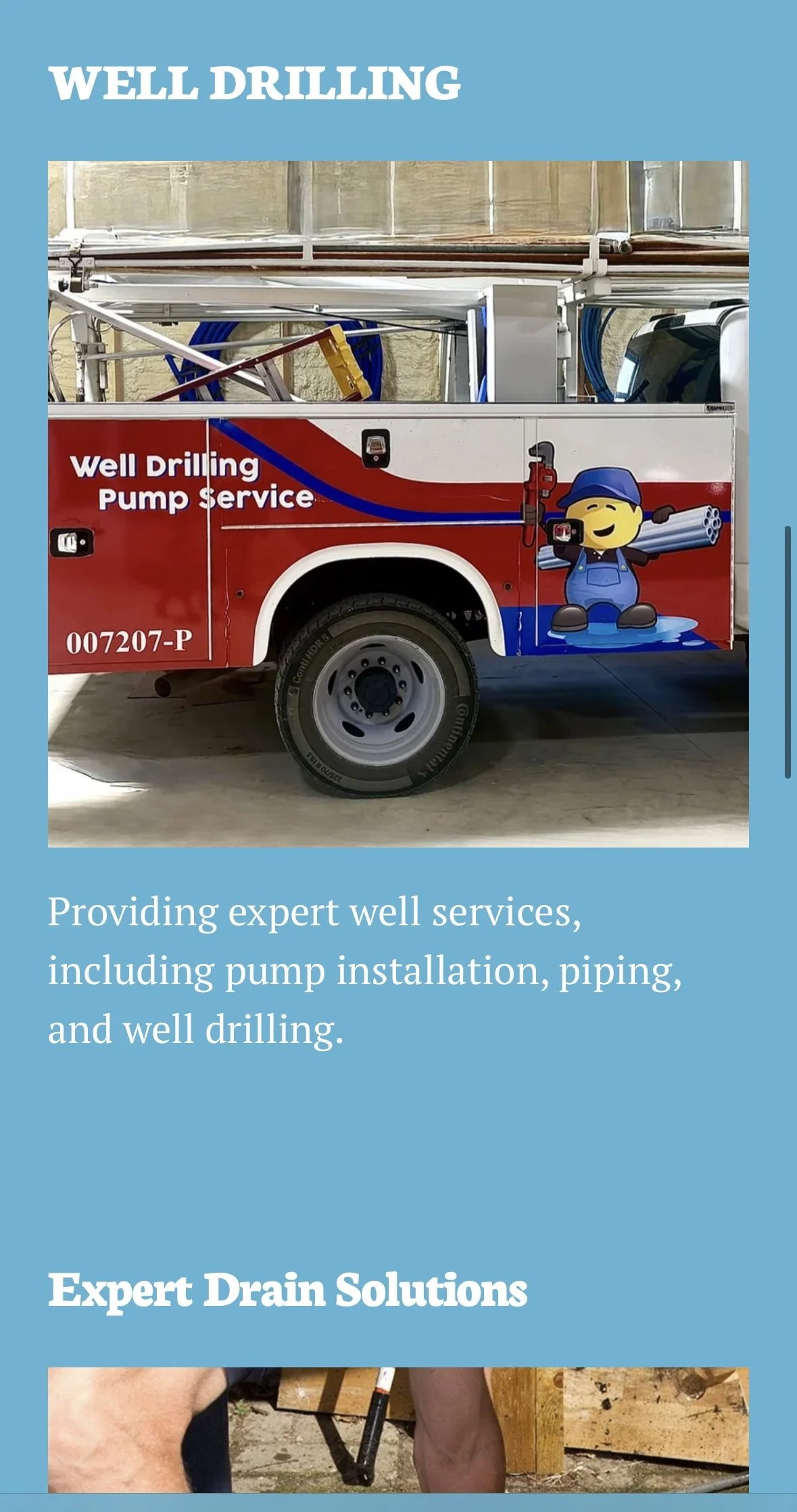 A service truck for well drilling and pump service, featuring a cartoon character wearing a blue cap and overalls holding pipes, with the text "Well Drilling Pump Service" and contact details, parked indoors.
