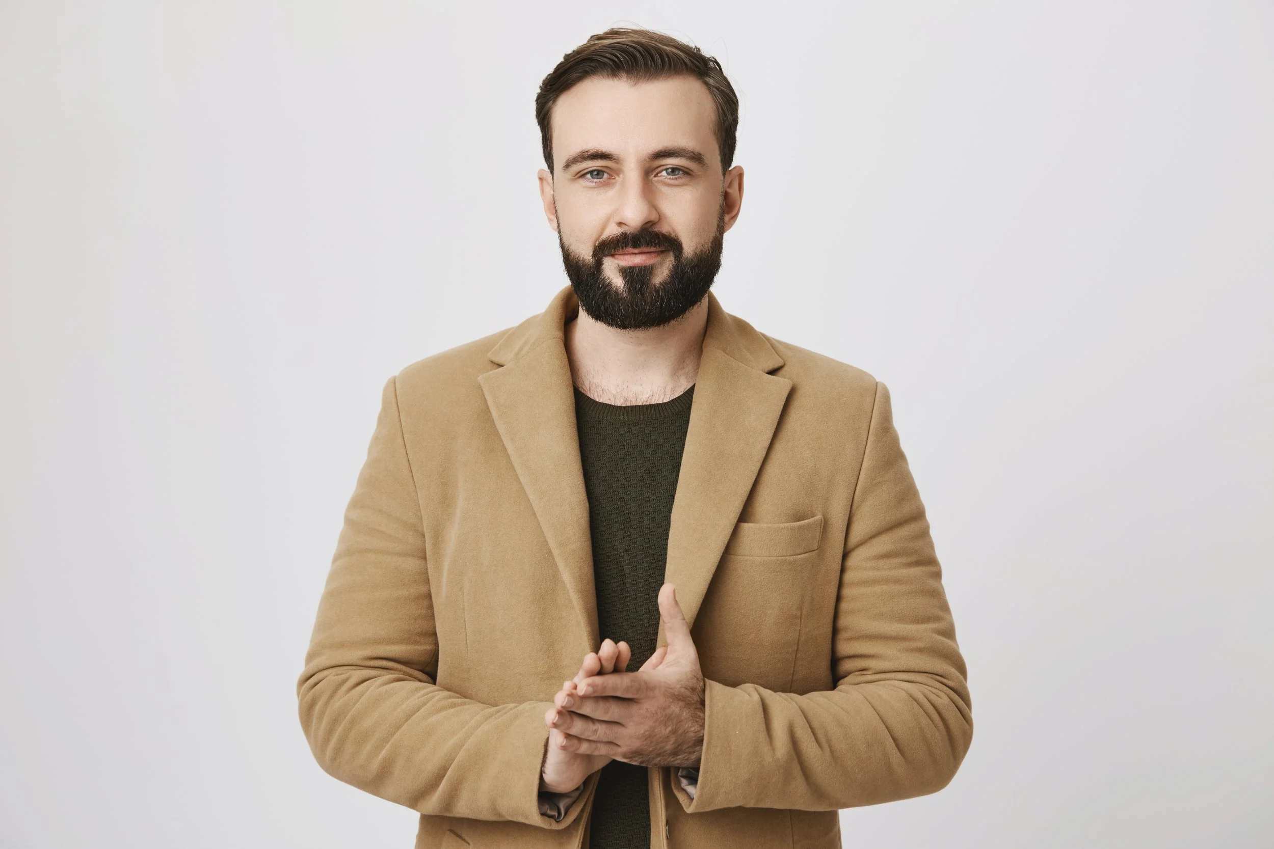handsome-bearded-businessman-rubbing-hands-having-deal.jpg