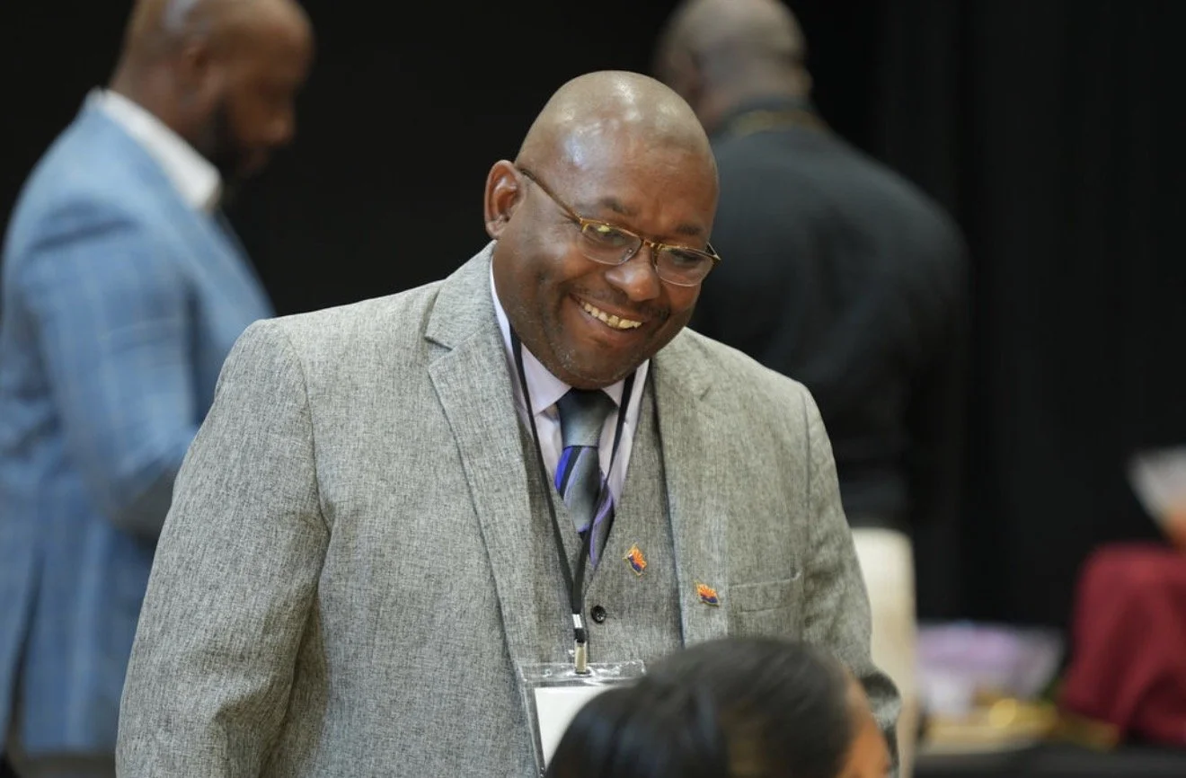 Dr. Stephen Neal Jr smiling to a crowd