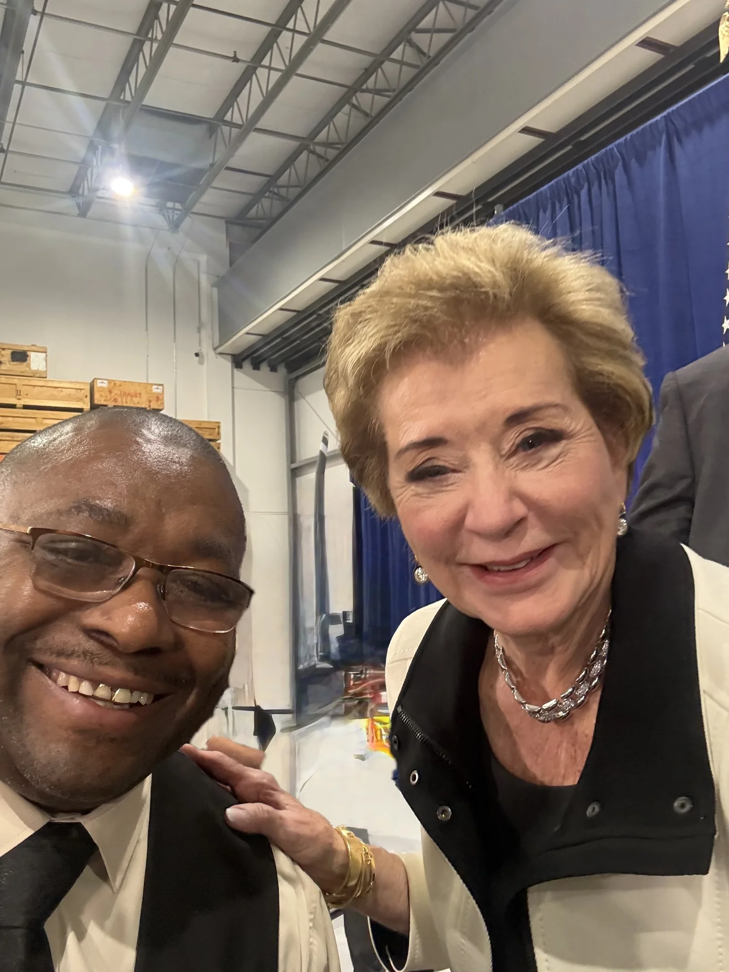 Dr. Neal and a woman smiling together at an event