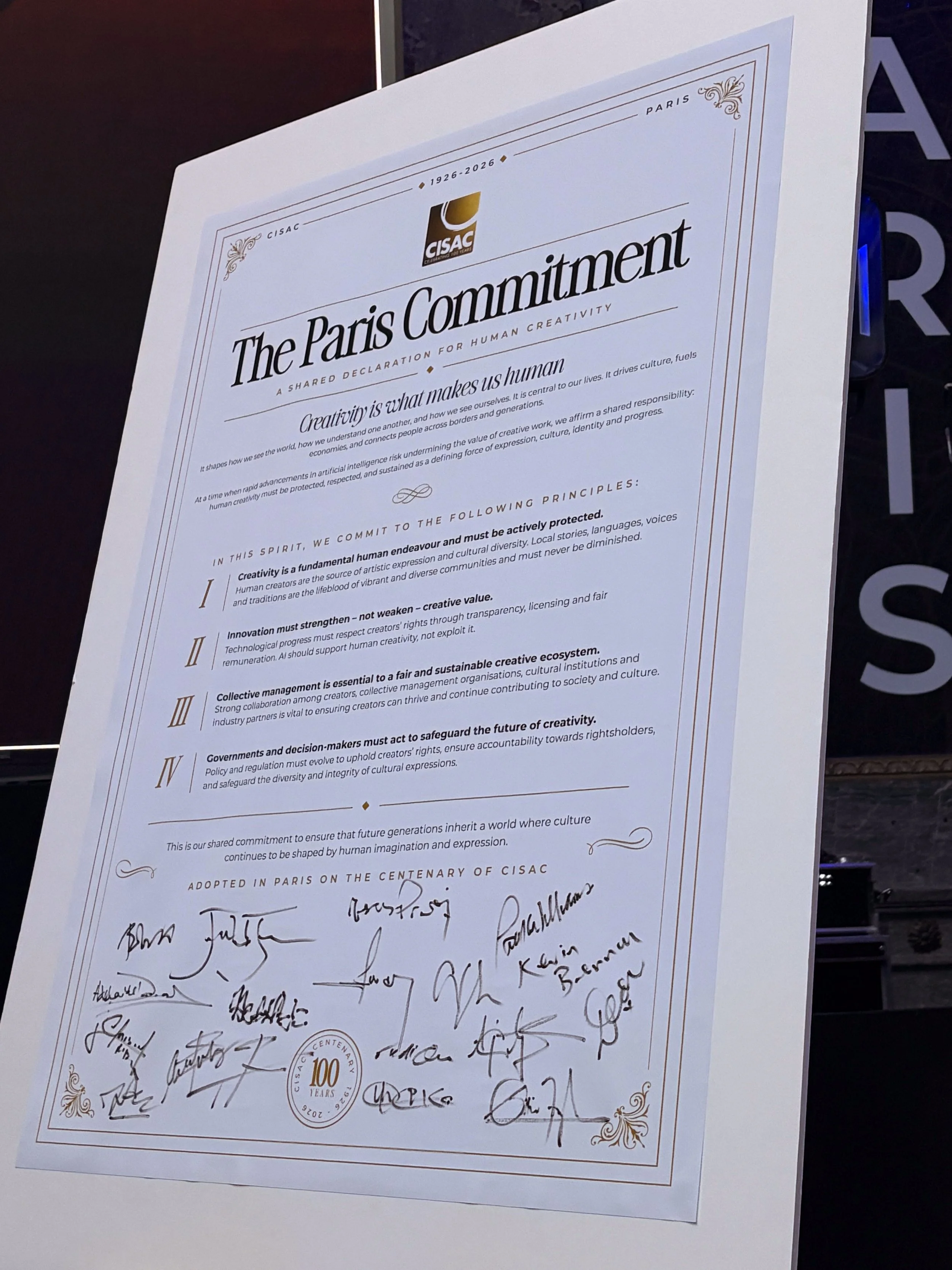 Photo of The Paris Commitment signed by CISAC representatives