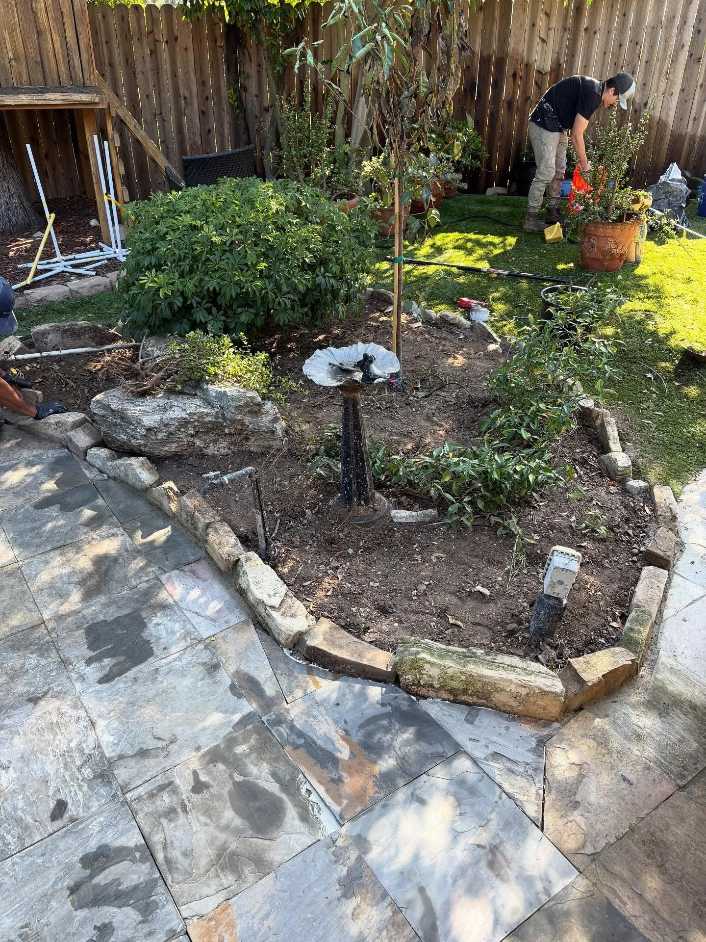 PLANTER BED BOARDER CONCRETED IN WITH PV STONE, AND NEW TILE INSTALLED