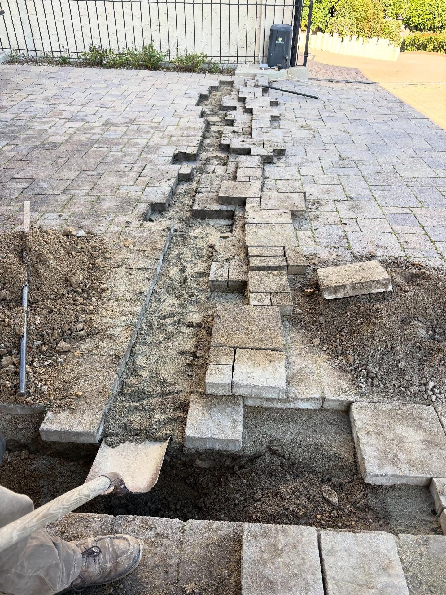 RESTORING POWER TO GATE: PAVERS PULLED, TRENCH DUG OUT, NEW CONDUIT, NEW GFCI, PAVERS SET BACK INTO PLACE