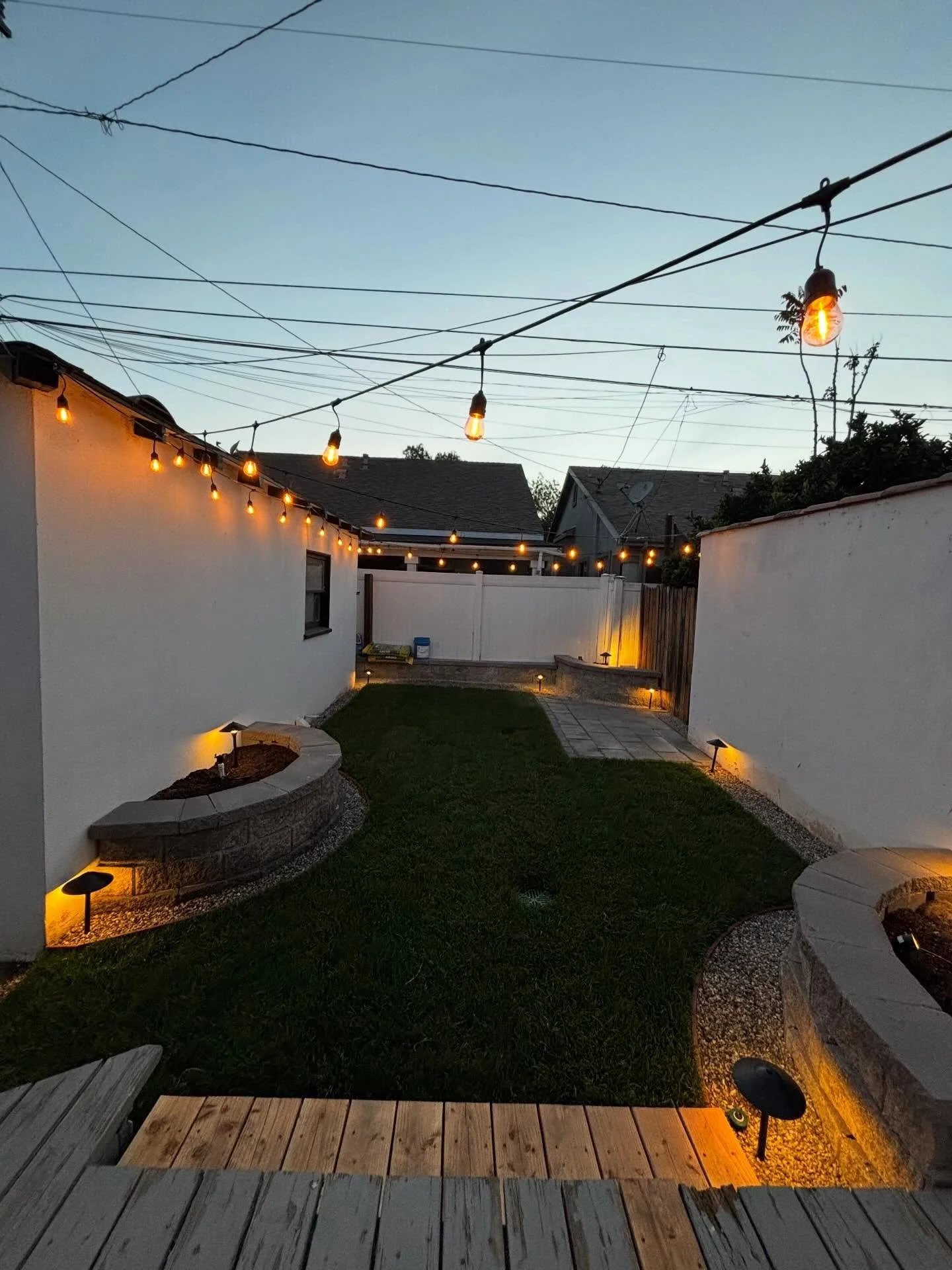 BACKYARD REMODEL: SMALL RETAINING WALL, DRAINS AND FRENCH DRAINS, SPRINKLER SYSTEM, SOD INSTALLATION,  LOW VOLTAGE INSTALLATION, DECK REPAIR, SMALL CONCRETE PAVER PAD &amp; 3X STONE PLANTER BEDS INSTALLED.