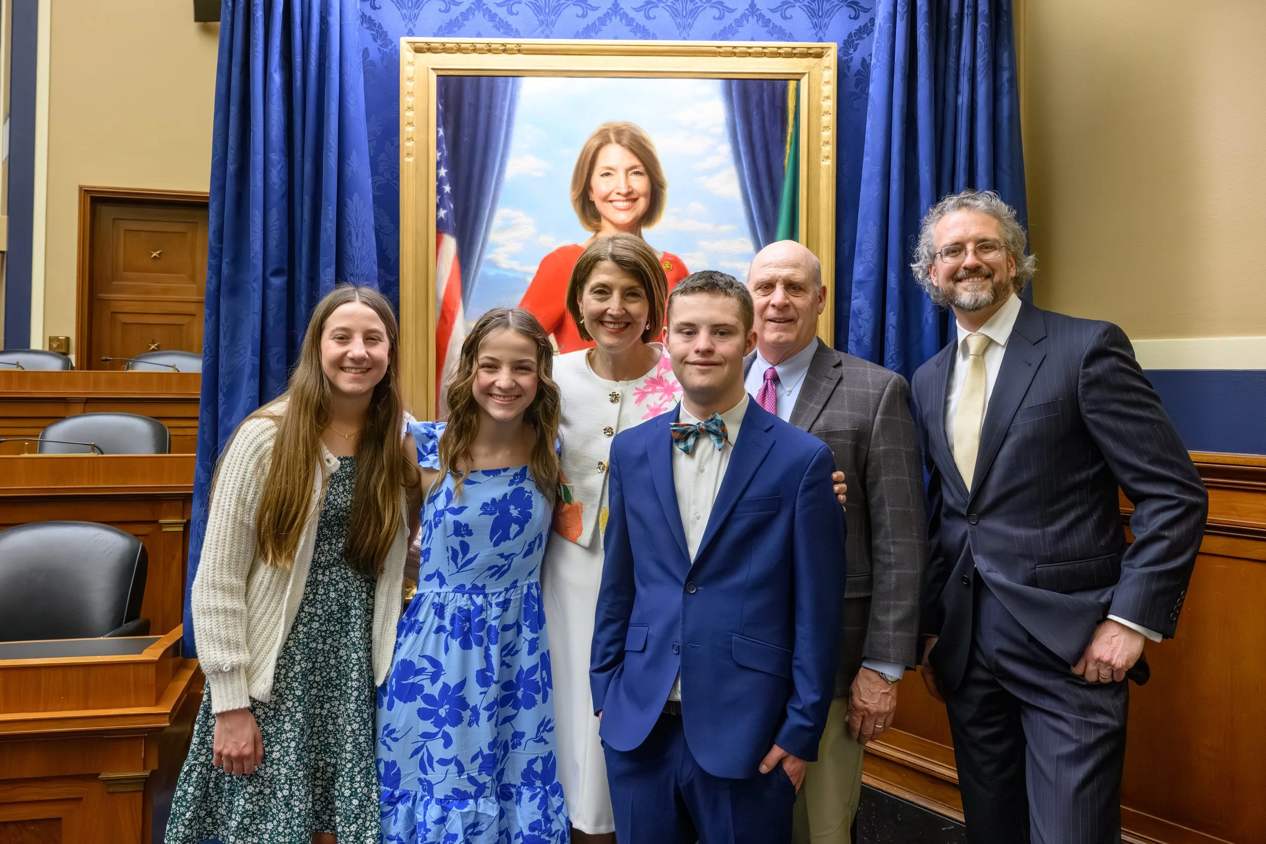 Cathy and the Rodgers Family with portrait artist, Joseph Daily