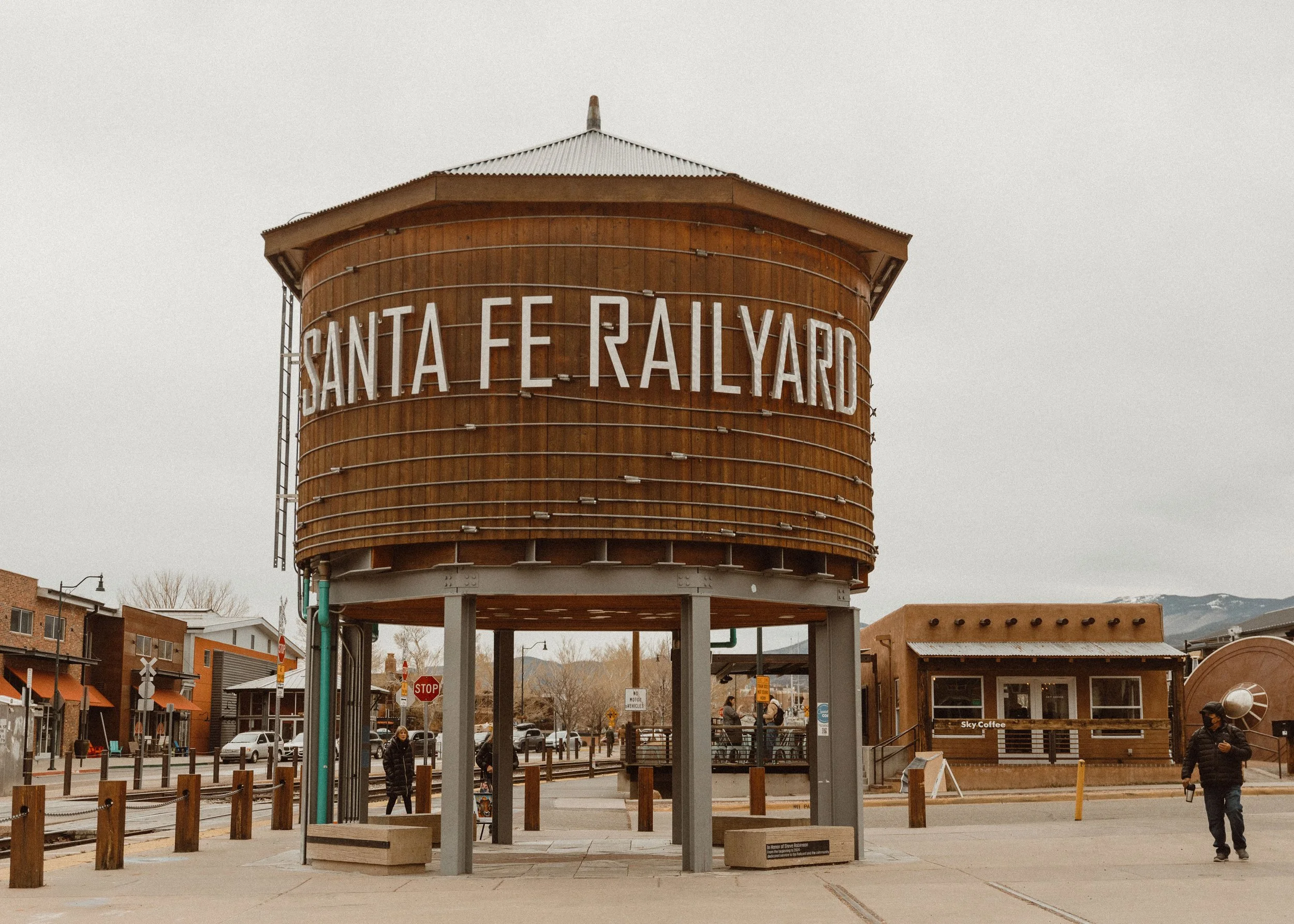 The Santa Fe Railyard water tower in Santa Fe, New Mexico, with a wooden exterior and large white lettering.