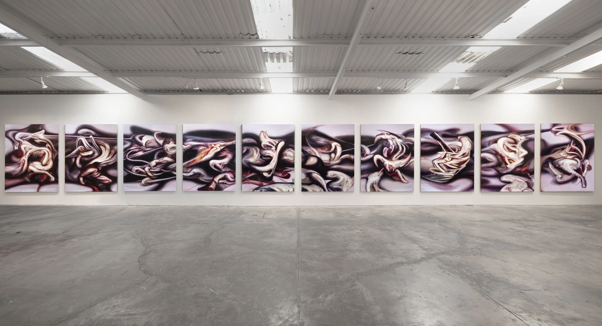 Gallery of abstract art paintings with swirling patterns in shades of purple, black, white, and hints of red, displayed in a modern art gallery with white walls and wooden floor.