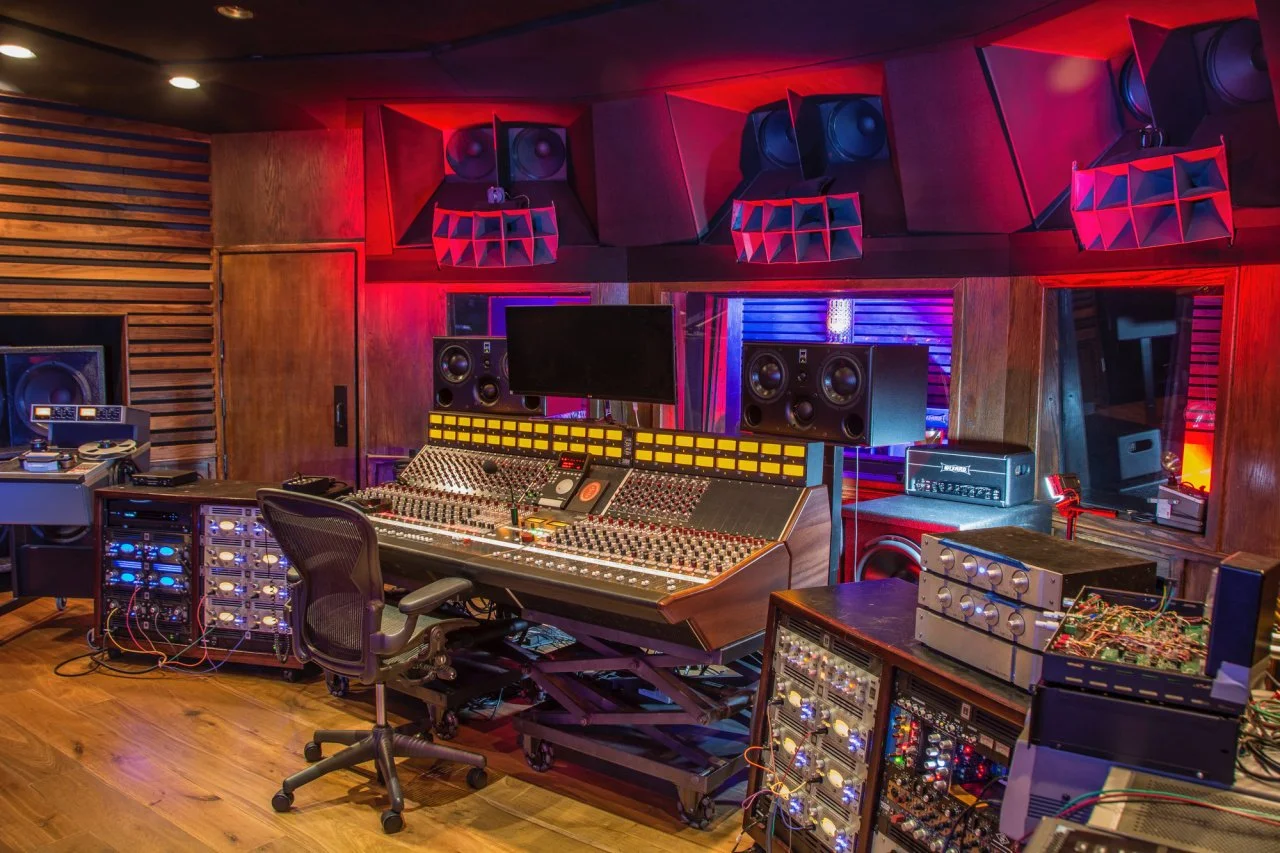 Los Angeles recording studio control room with analog console and dramatic lighting.
