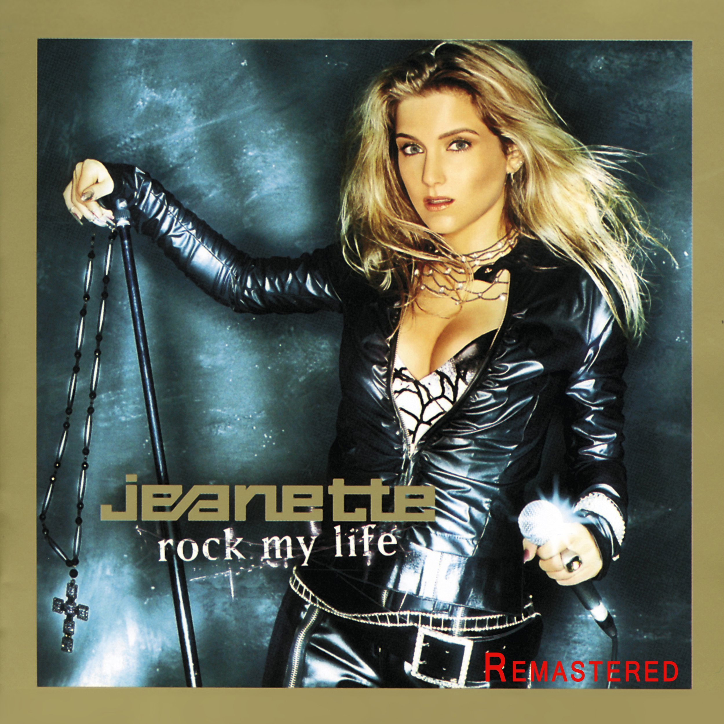 Das Albumcover zeigt Jeanette Biedermann mit langen blonden Haaren, die in einem schwarzen, glänzenden Lederoutfit mit einem Mikrofon in der Hand posiert. Der Hintergrund ist dunkel und neblig. Der Text auf dem Cover lautet 'Jeanette rock my life'.