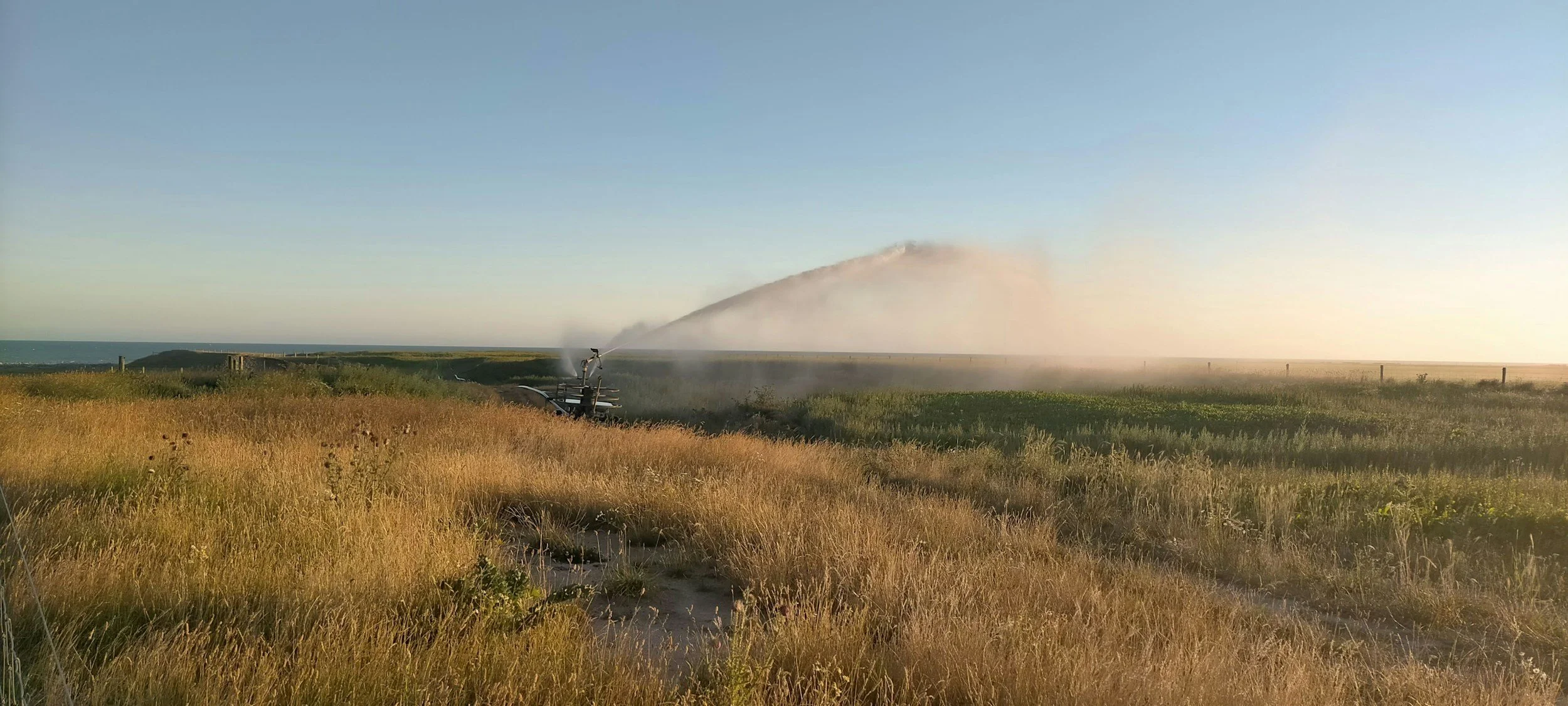 A photograph of an irrigation system on farmland