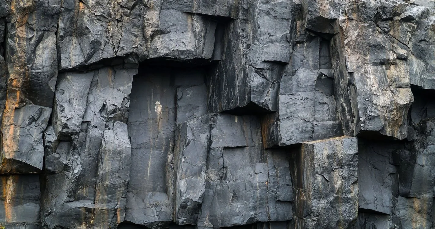 A close up photograph of a basalt rockface in a quarry