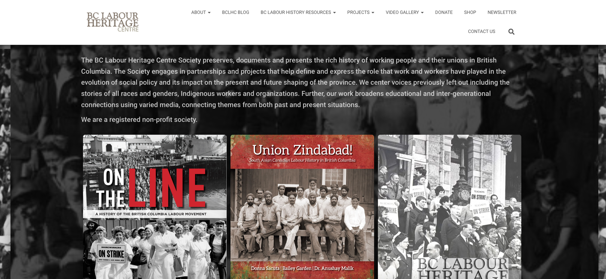 A screenshot shows the old BCLHC website. The website background is a black and white image of lots of people. There is white text over the image and three poster-style images underneath.