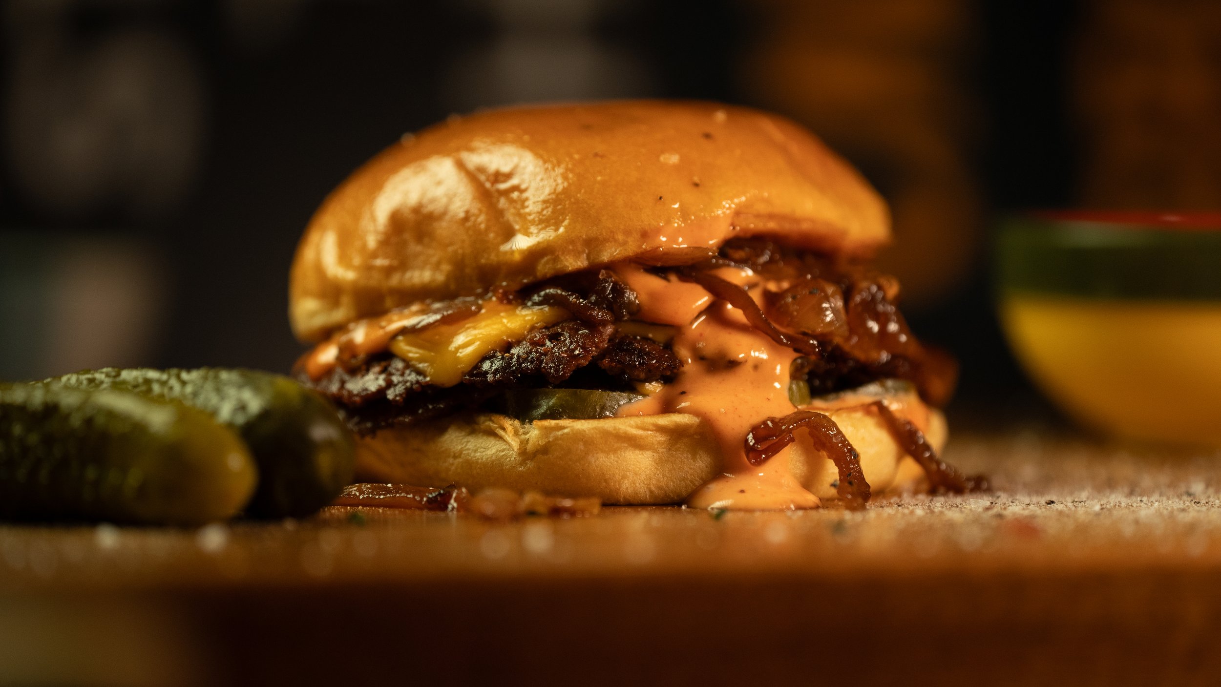 Beef Smash Burger - Double 2oz. Angus brisket-chuck smashed patties with a crispy crust. With cheese, slow-cooked caramalised onions, gherkins and homemade burger sauce in a brioche bun. A customer favourite.