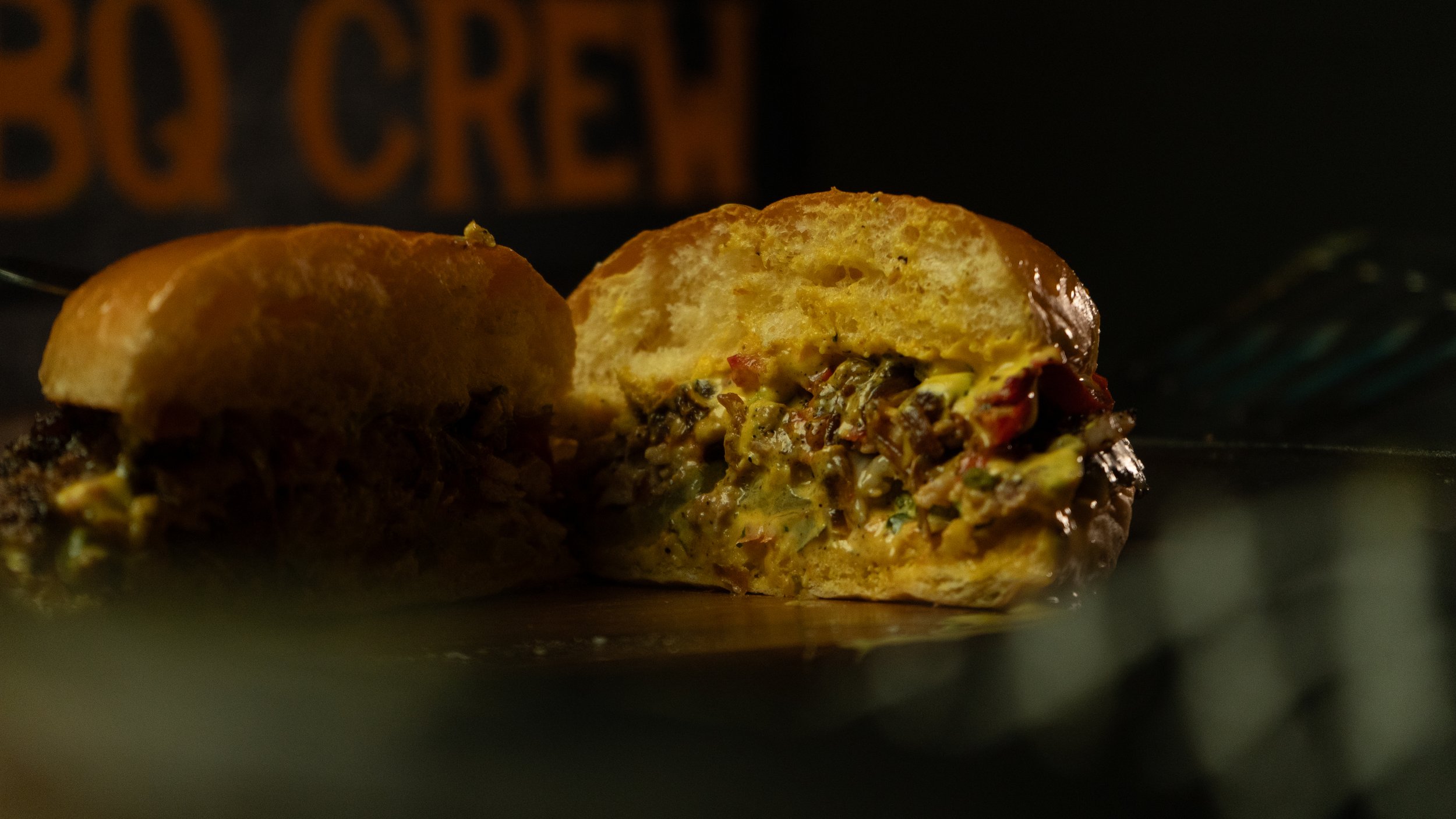 Chicken Smash Burger - Inspired by a trip to South America, our Peruvian aji amarillo sauce compliments smashed chicken thigh patties. With cheddar cheese, caramelised onions, grilled red peppers and gherkins.