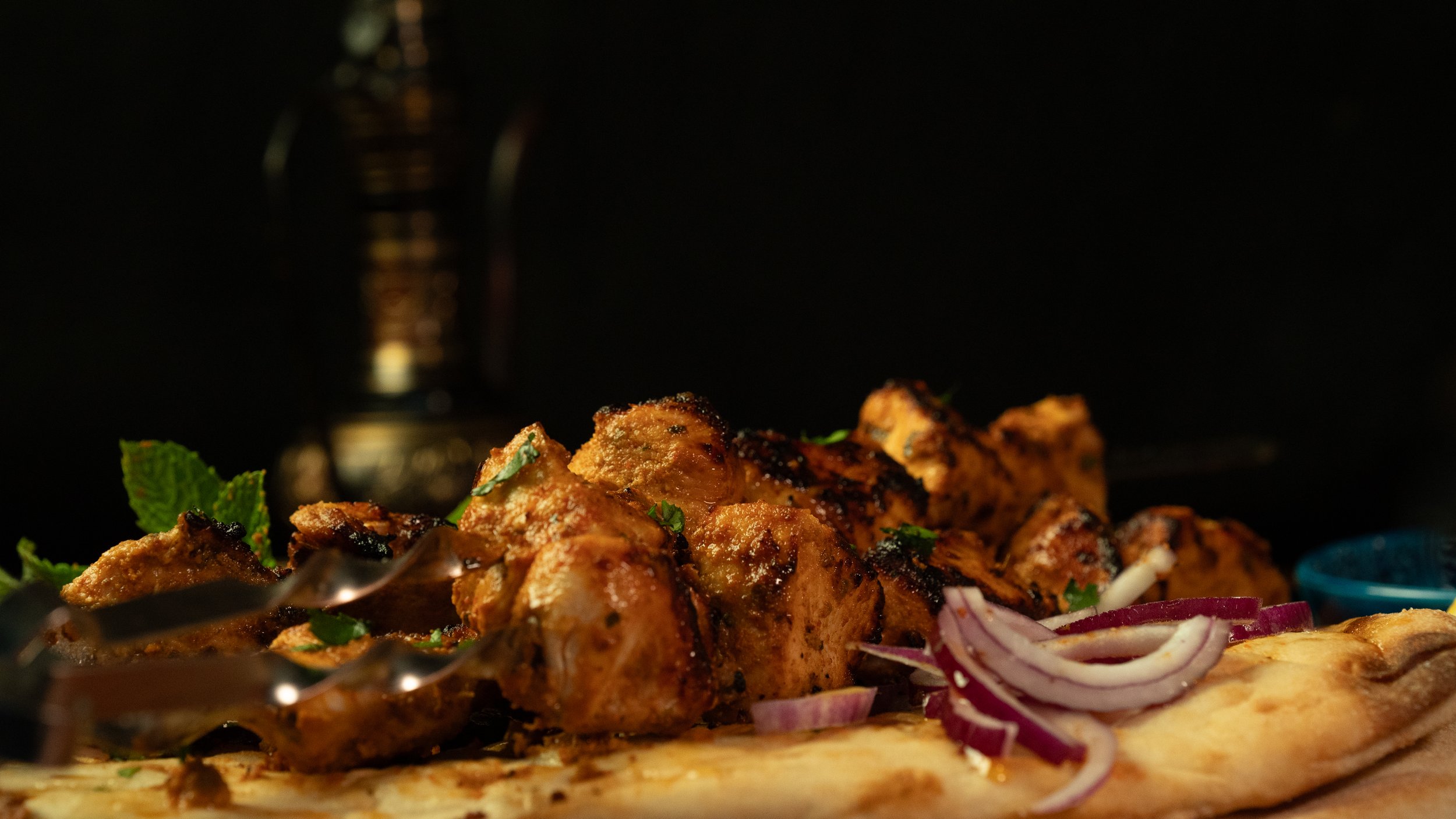 Chicken Tikka - We marinade cubes of succulent chicken tikka overnight in our traditional tandoori flavours, keeping them soft and tender. Skewered and cooked over an open flame.