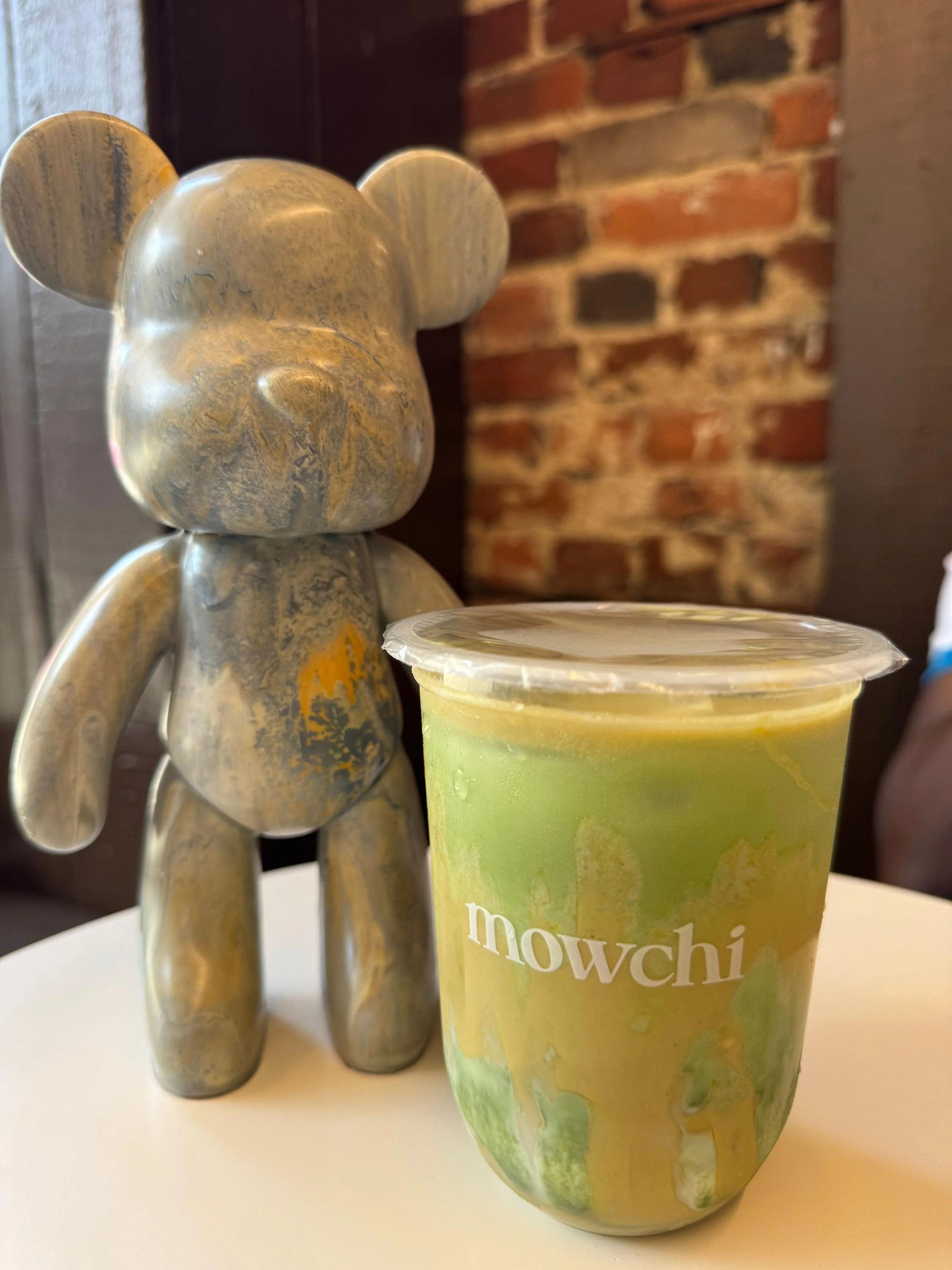 A painted bear next to a Mowchi Matcha