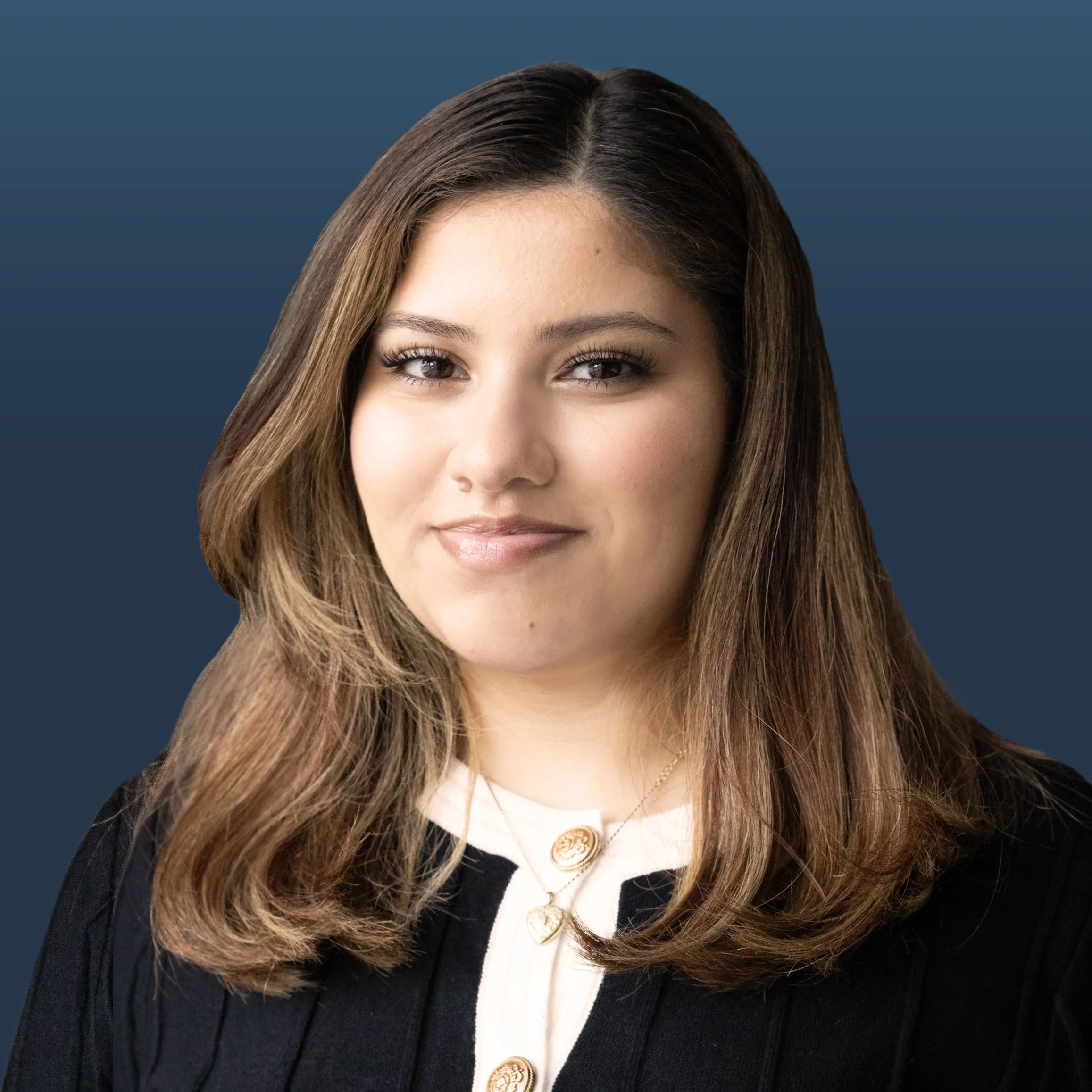 Young professional female with brown hair against navy background