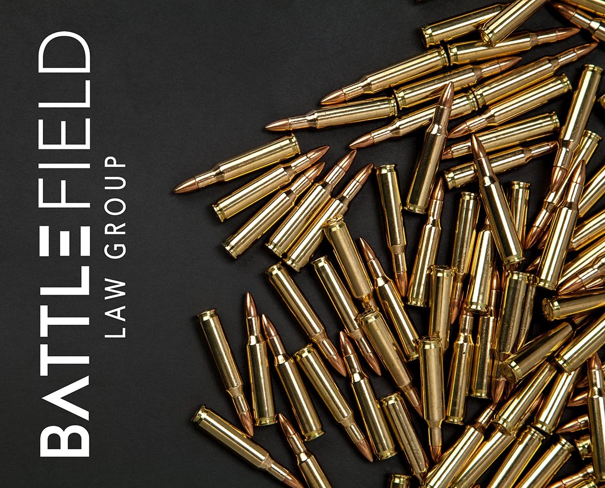 gold bullets on black background with Battlefield Law Group logo
