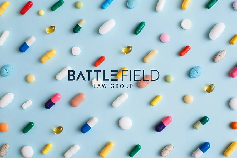 colorful prescription pills laid out in a pattern on light blue paper