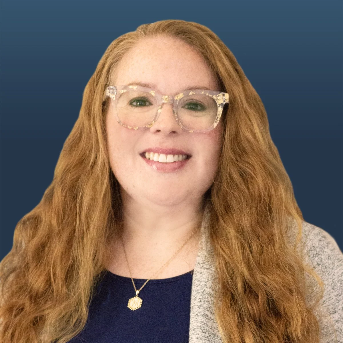 Professional female legal assistant with curly red hair and glasses