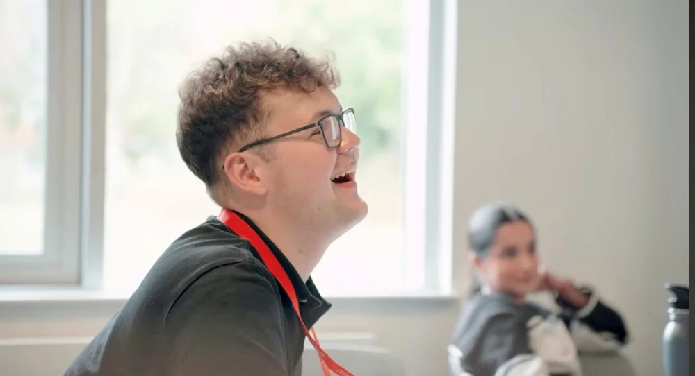 A Law participant laughing during a workshop