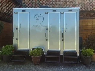 Foxy Loos restroom trailer rental featuring private entrances, flushing toilets, running water, and upscale amenities