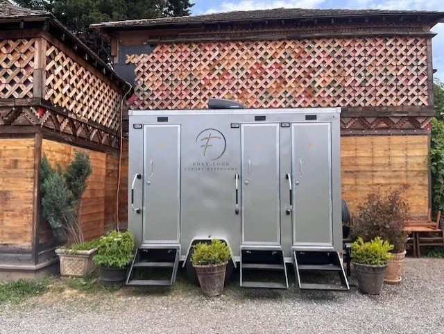 premium portable restroom trailer staged at at a wedding venue in parkdale, OR.  upscale mobile restroom featuring modern amenities, private stalls, running water and climate controlled.  Servicing Hood River, The Dalles, White Salmon, Goldendale, Po